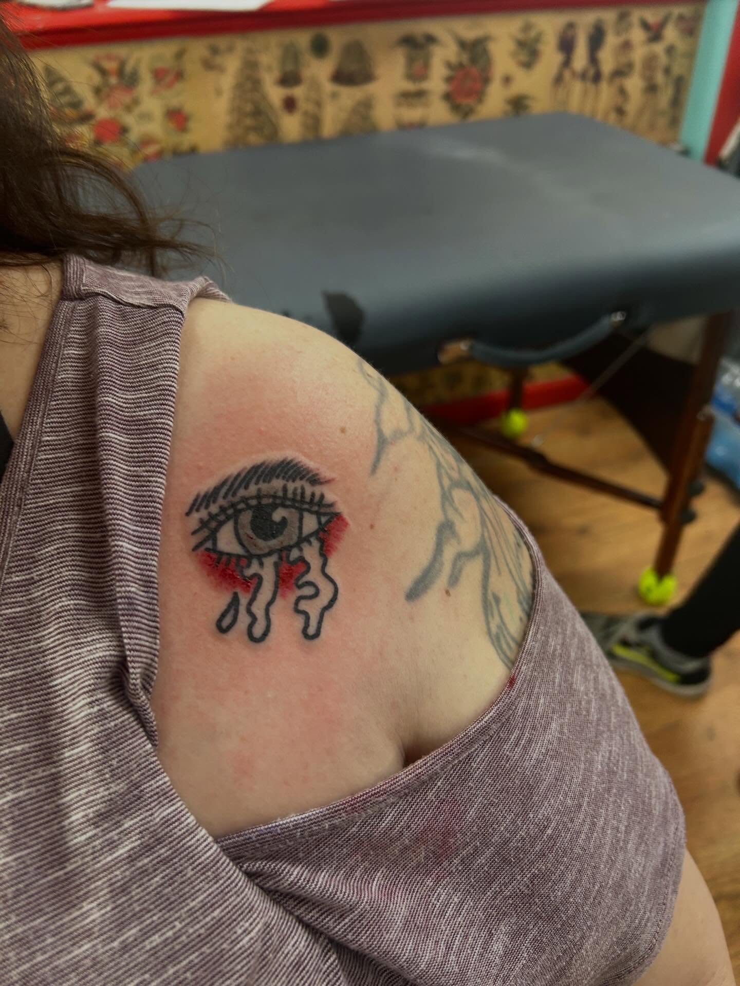 Tearful eye realism tattoo on the shoulder by Elizabeth Niederkorn