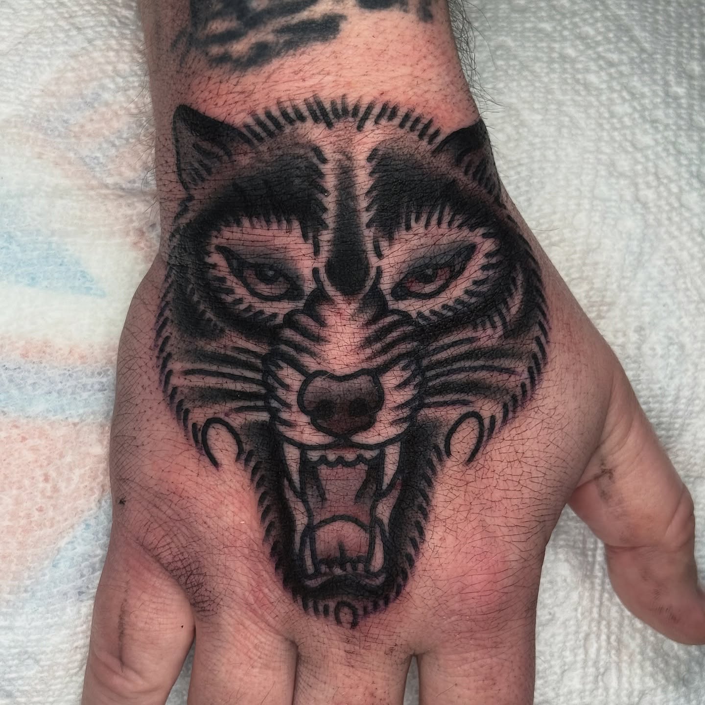 Wolf black and grey tattoo on the hand by ๐ฎ๐๐๐๐ ๐ญ๐๐๐๐๐