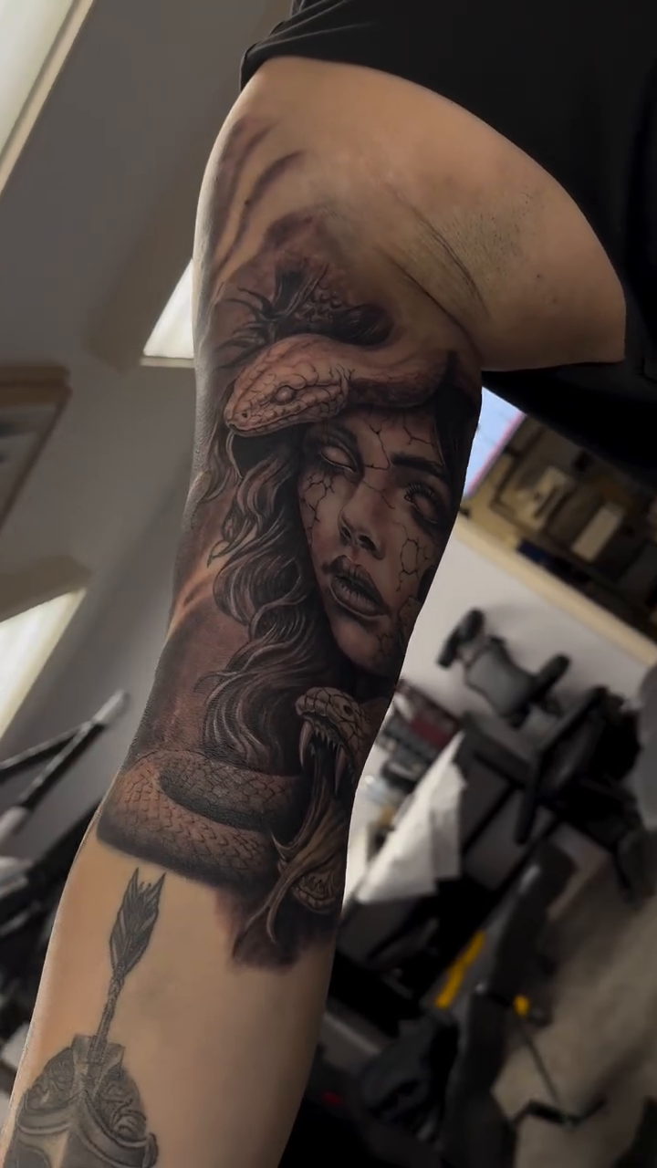 Medusa tattoo on arm realism tattoo on the upper arm by Juan Guzman