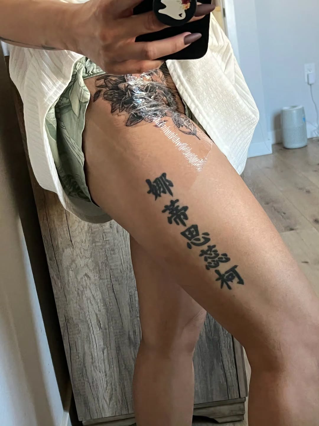 Chinese characters and floral design Japanese tattoo on the thigh by Jeff Frederick