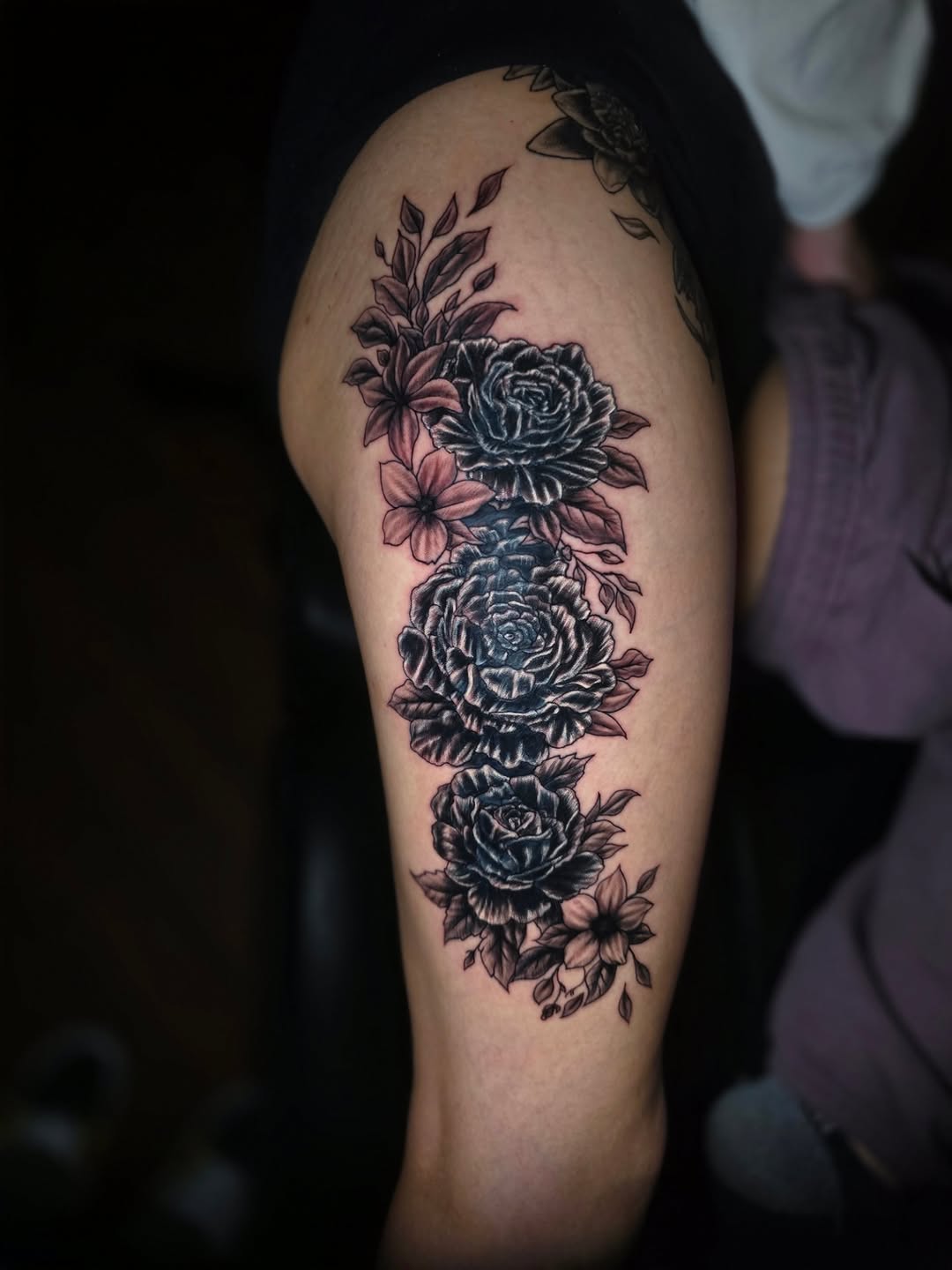 Roses and flowers neo-traditional tattoo on the thigh by Jeff Frederick