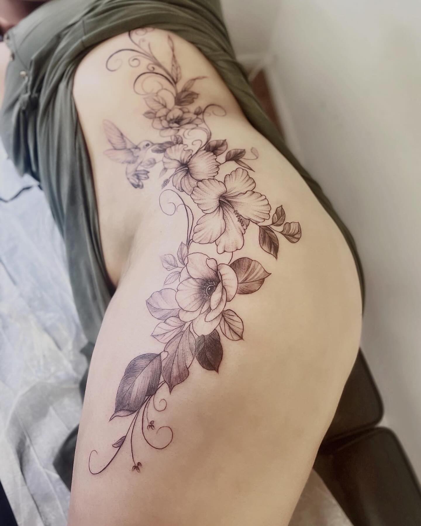 Floral arrangement black and grey tattoo on the thigh by New Root Ink _Studio