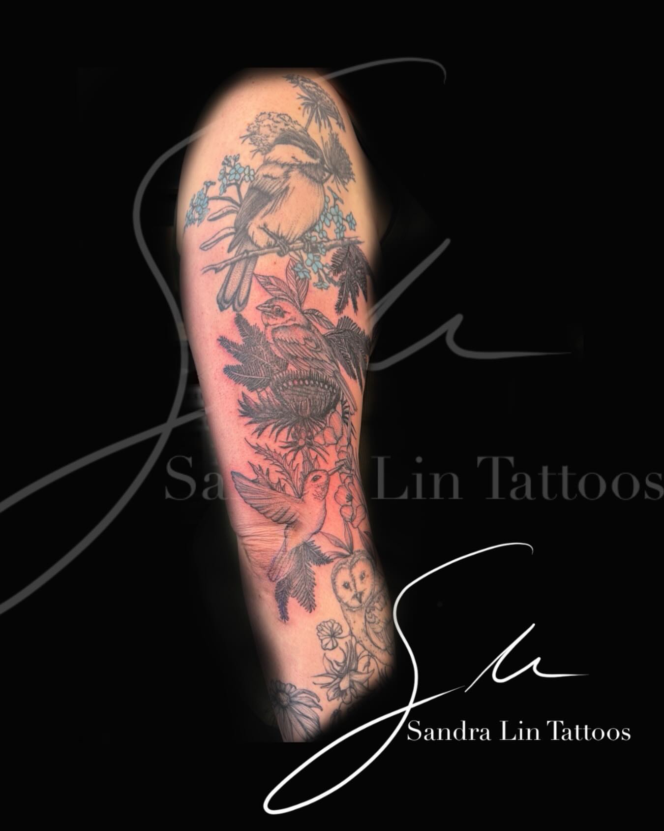 Birds and flowers American traditional tattoo on the forearm by Sandra Lin Cue