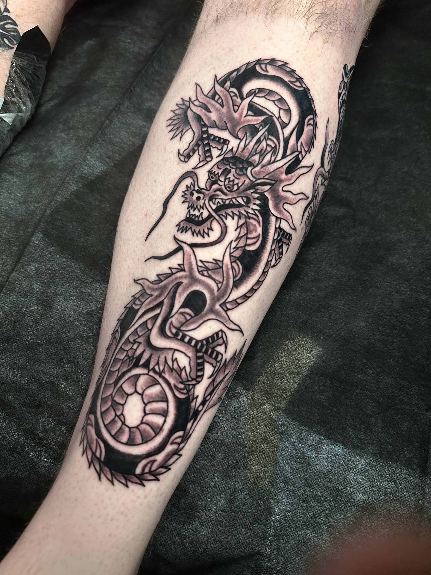 Dragon black and grey tattoo on the forearm by A.j. Lingerfeldt, Nashville, Tennessee