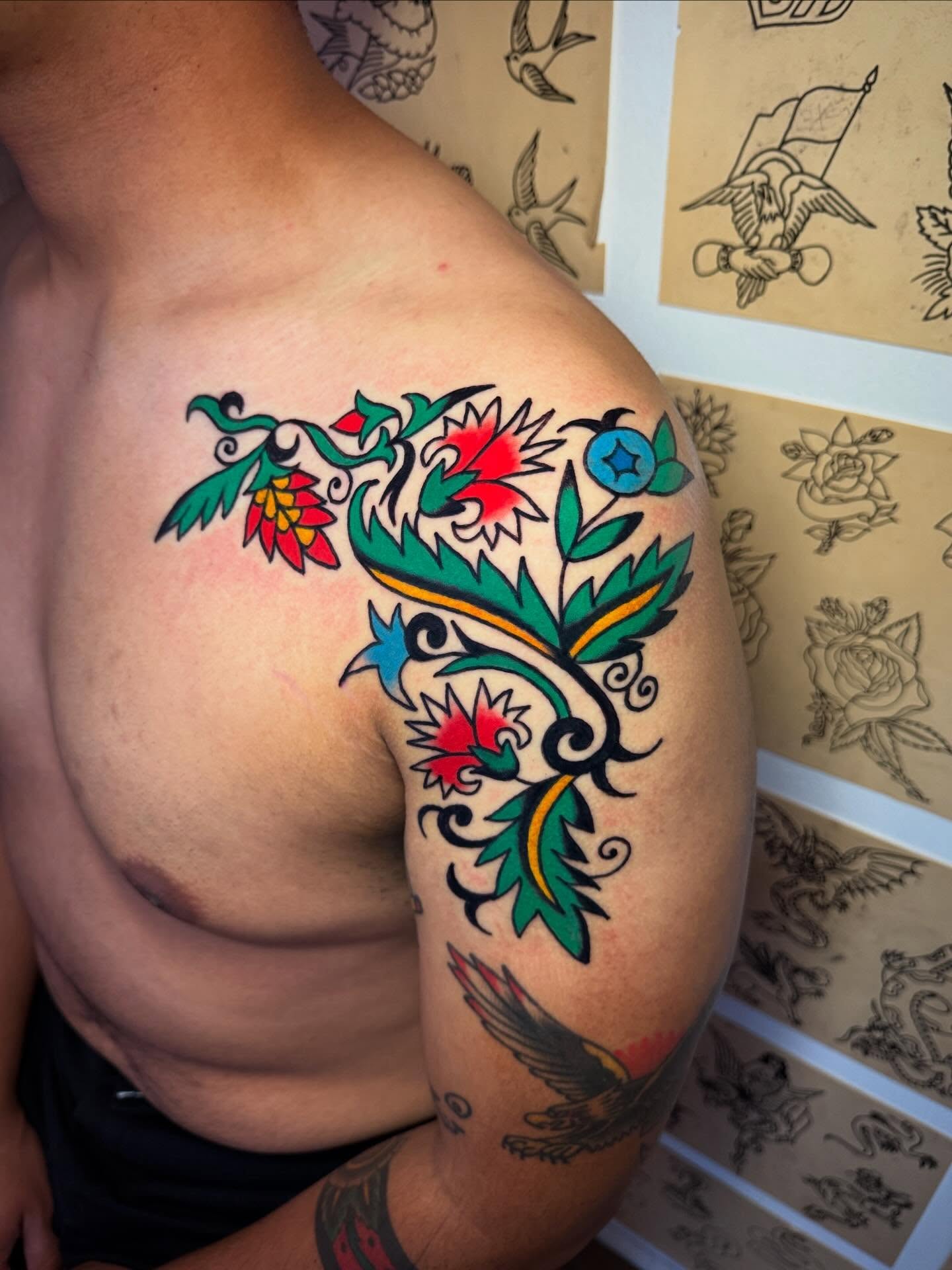 Floral vine American traditional tattoo on the shoulder by Britt Kuechenmeister, Culver City, California
