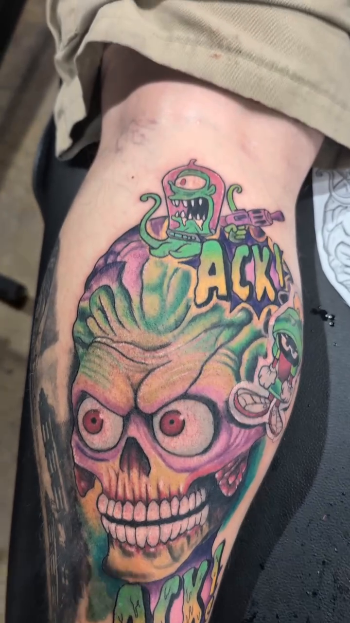 Zombie skull with monster and text American traditional tattoo on the forearm by Ben Cecil, Summerville, South Carolina