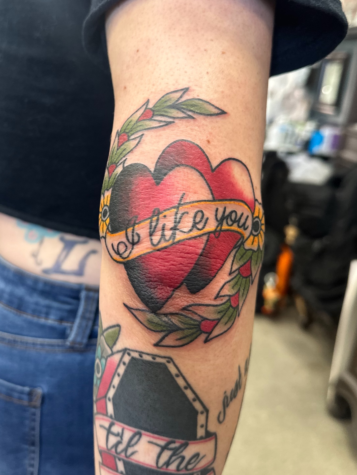 Heart with banner American traditional tattoo on the forearm by Walk-in American Traditional Tattoos Las