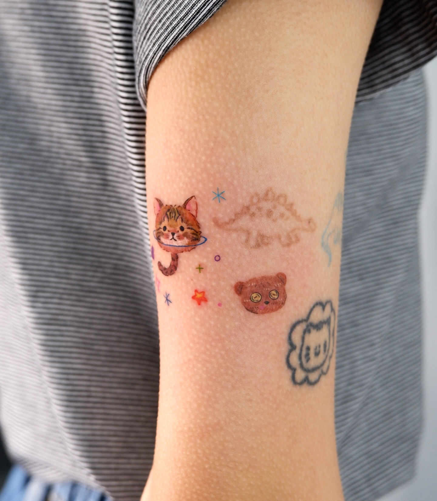 Cat and bear dotwork tattoo on the forearm by 타투 Seon 컬러타투