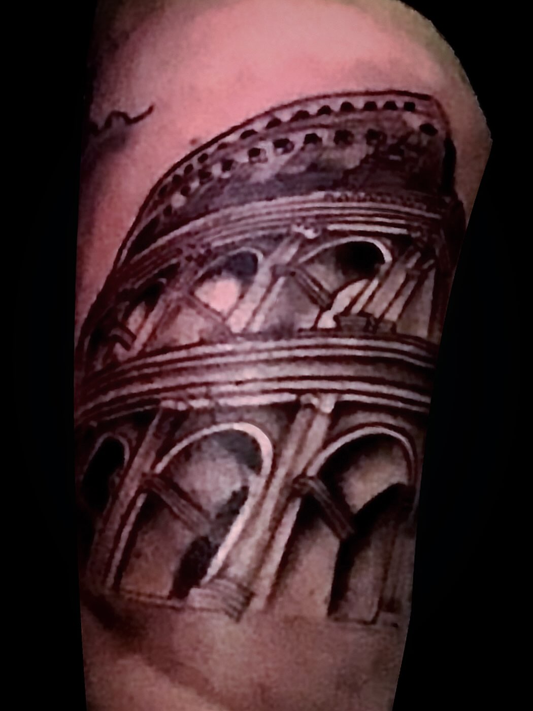 Colosseum black and grey tattoo on the forearm by Gessel Leticia Enriquez