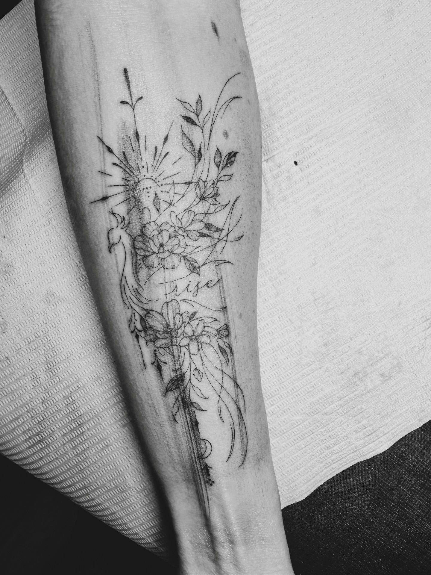 Floral bouquet dotwork tattoo on the forearm by Reverie Studio