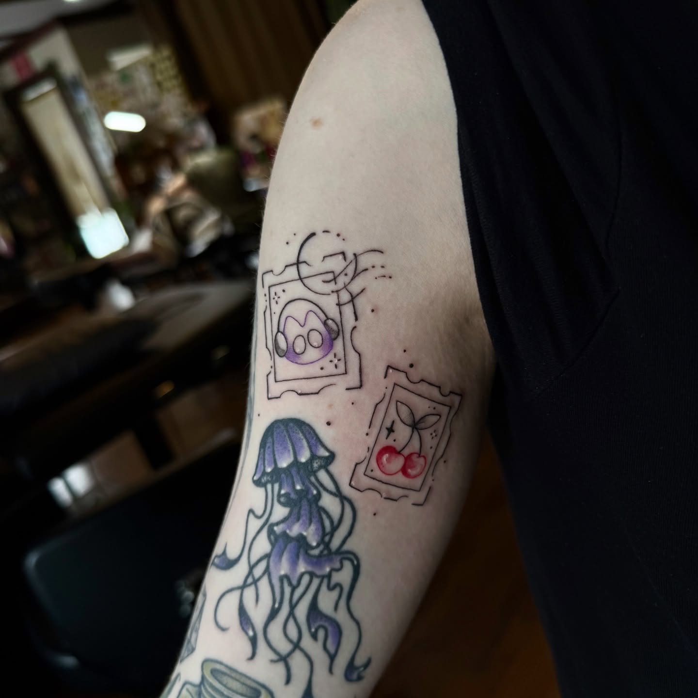 Jellyfish and cherries dotwork tattoo on the forearm by Jynx