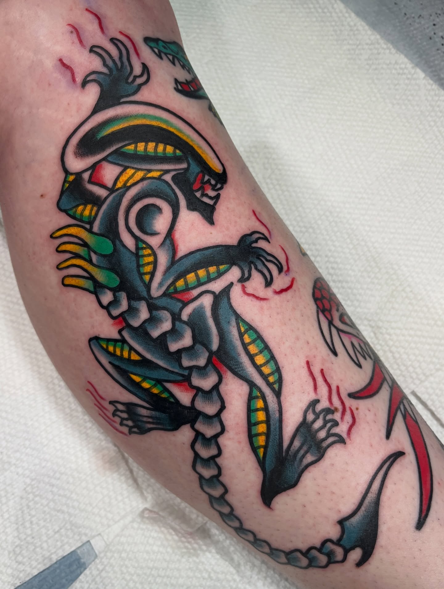 Alien creature American traditional tattoo on the forearm by Charlie Ostrom, Durham, North Carolina