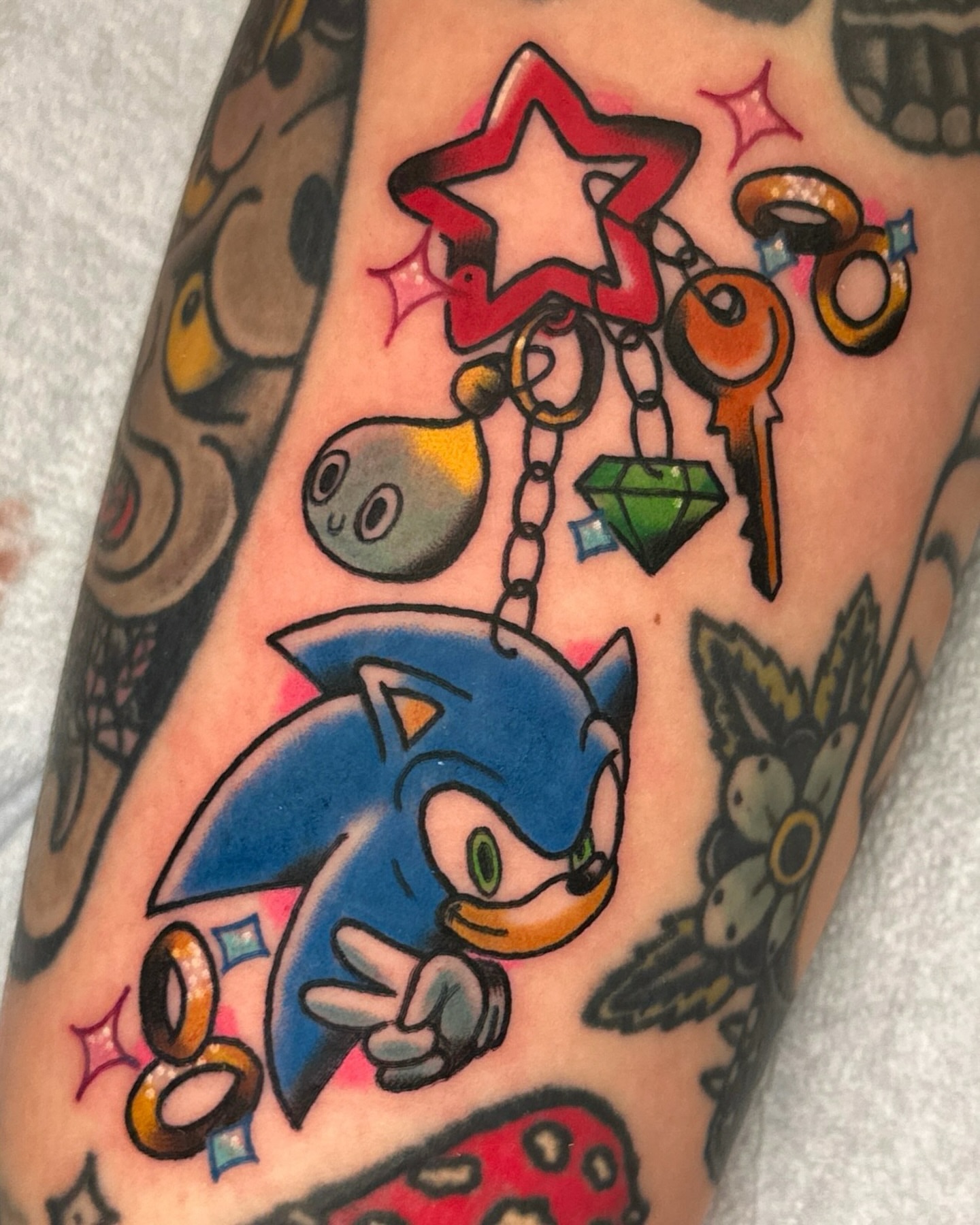 Sonic the Hedgehog American traditional tattoo on the forearm by Paige Ochoa