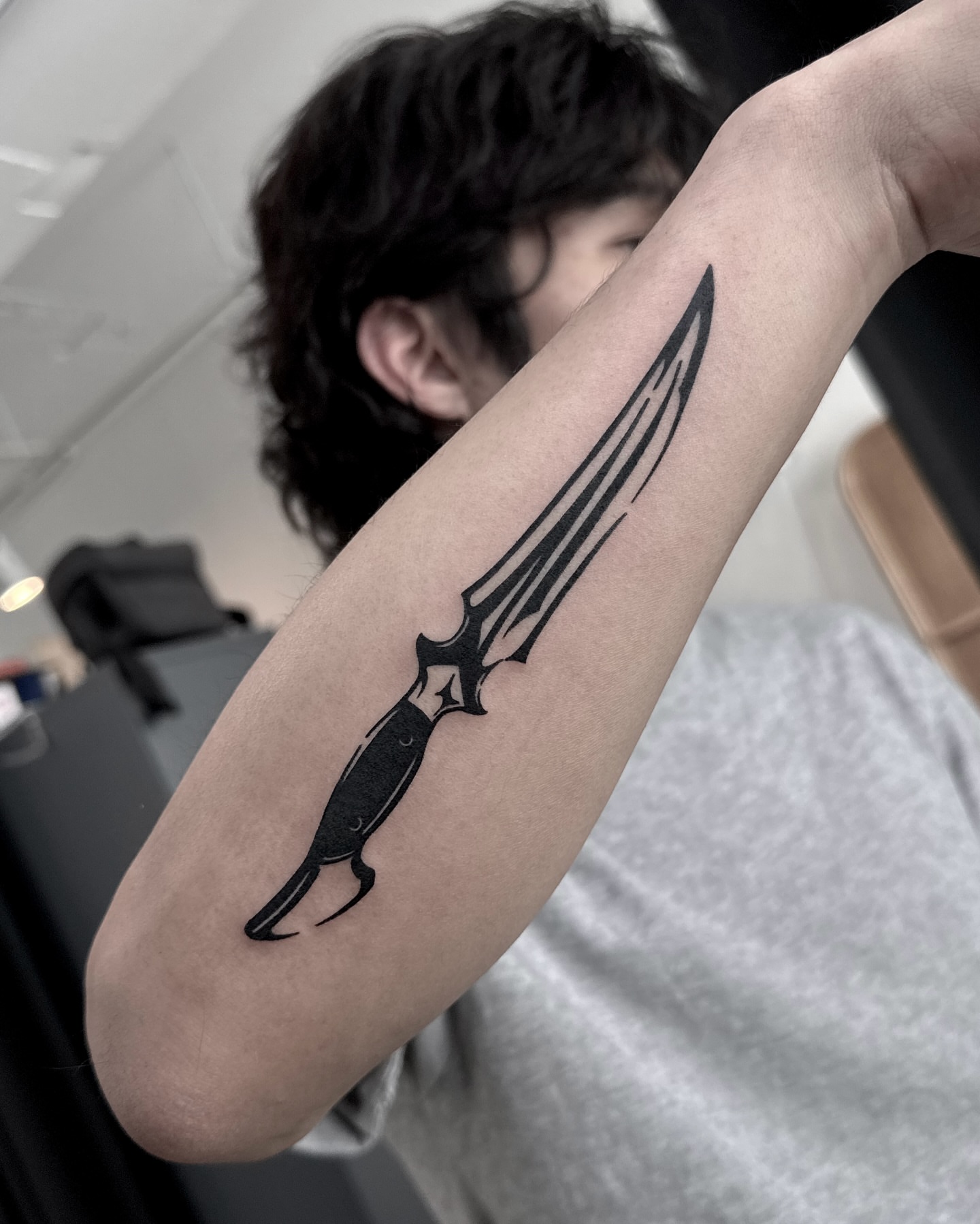 Knife black and grey tattoo on the forearm by 블랙워크 로니  blackwork roni