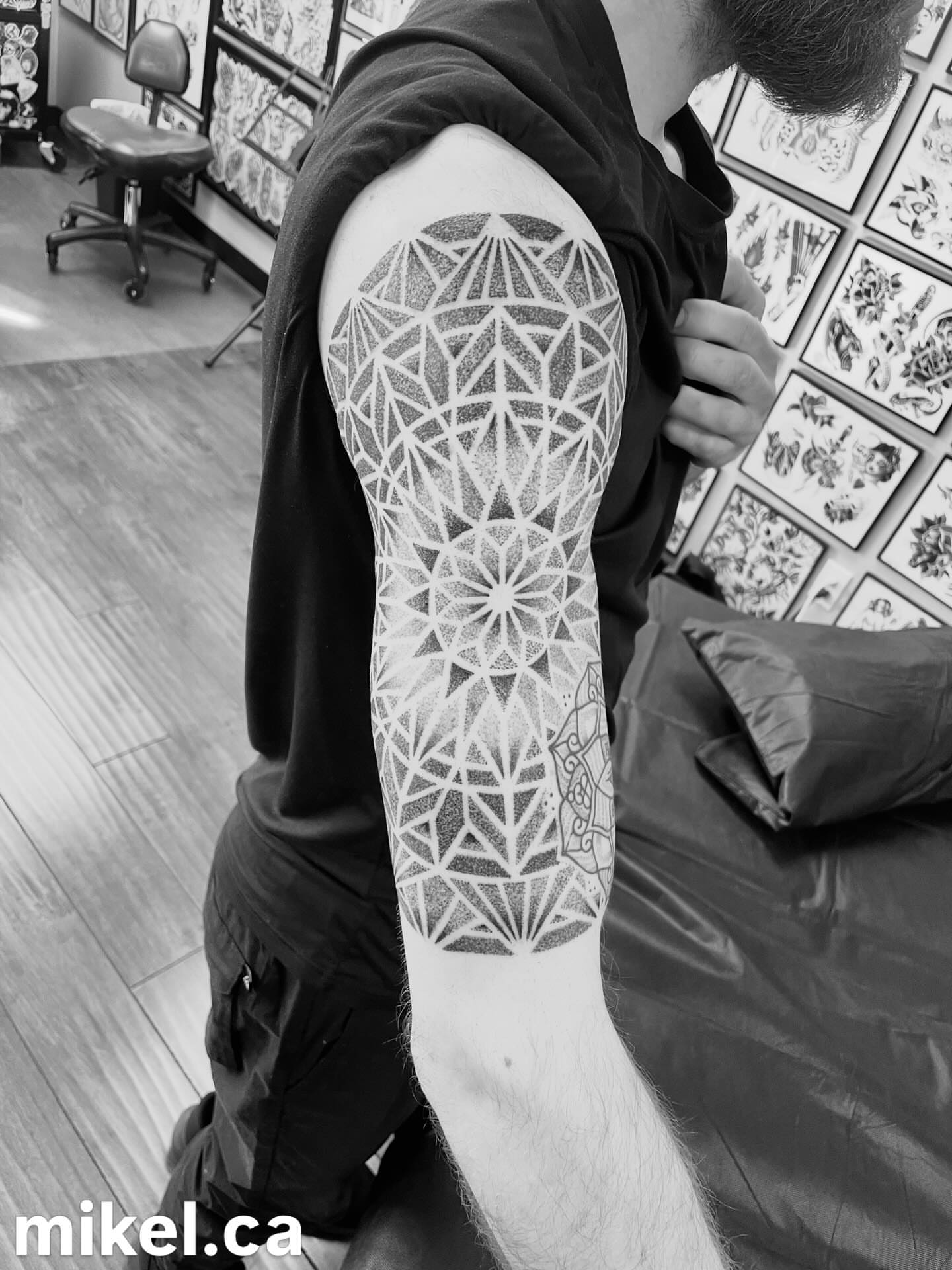 Geometric pattern dotwork tattoo on the forearm by mikel_tattoosangha