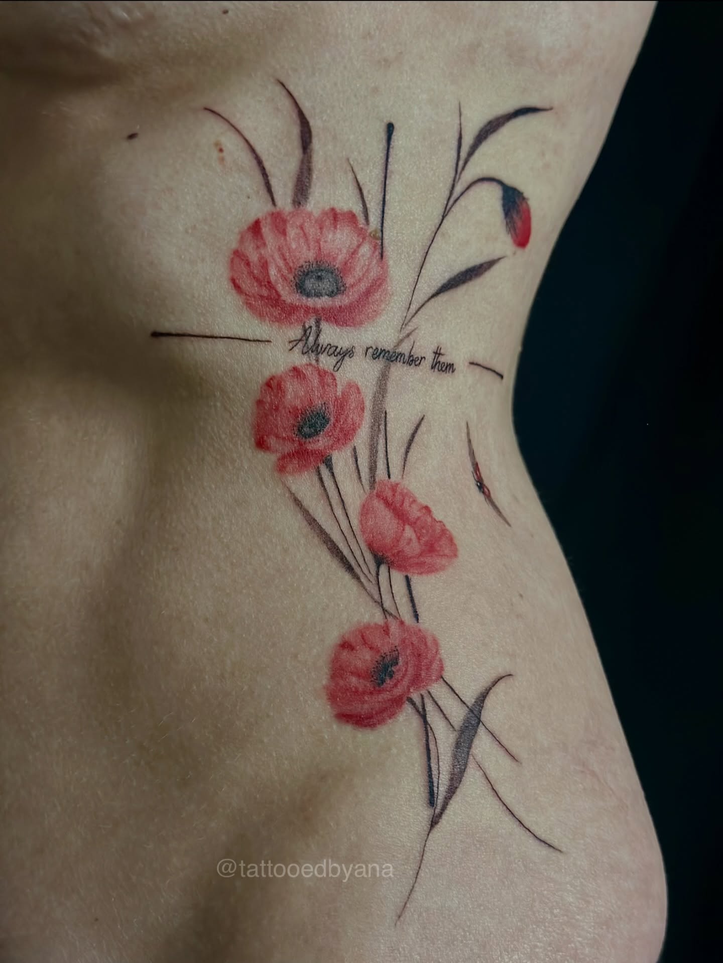 Red poppies watercolor tattoo on the ribs by Tattoo artist Denver