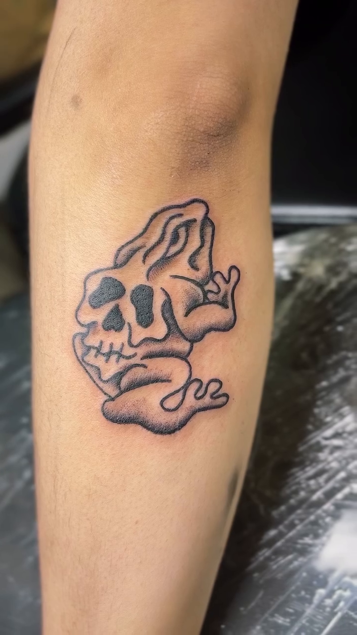 Skull frog dark art tattoo on the forearm by Jason Topliss