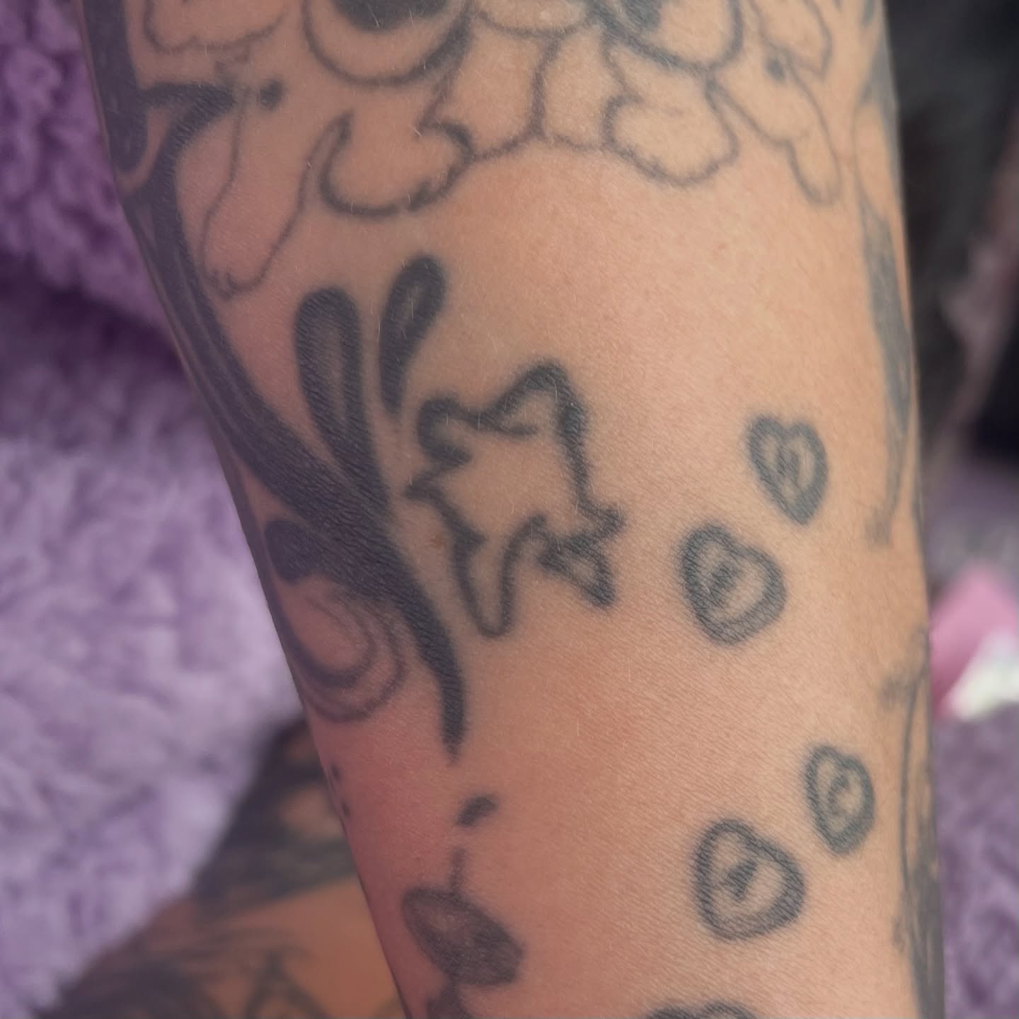 Flower and butterfly black and grey tattoo on the forearm by kale