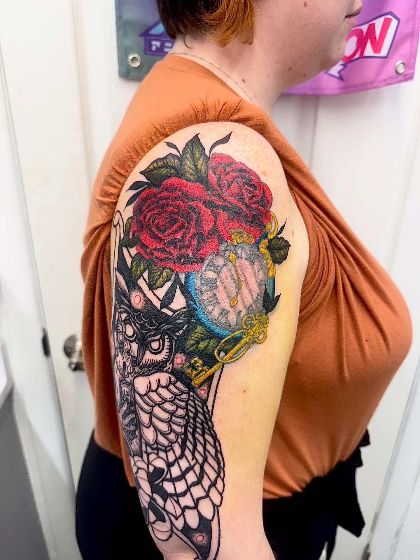 Owl and roses American traditional tattoo on the upper arm by Abby Ash, Belington, West Virginia