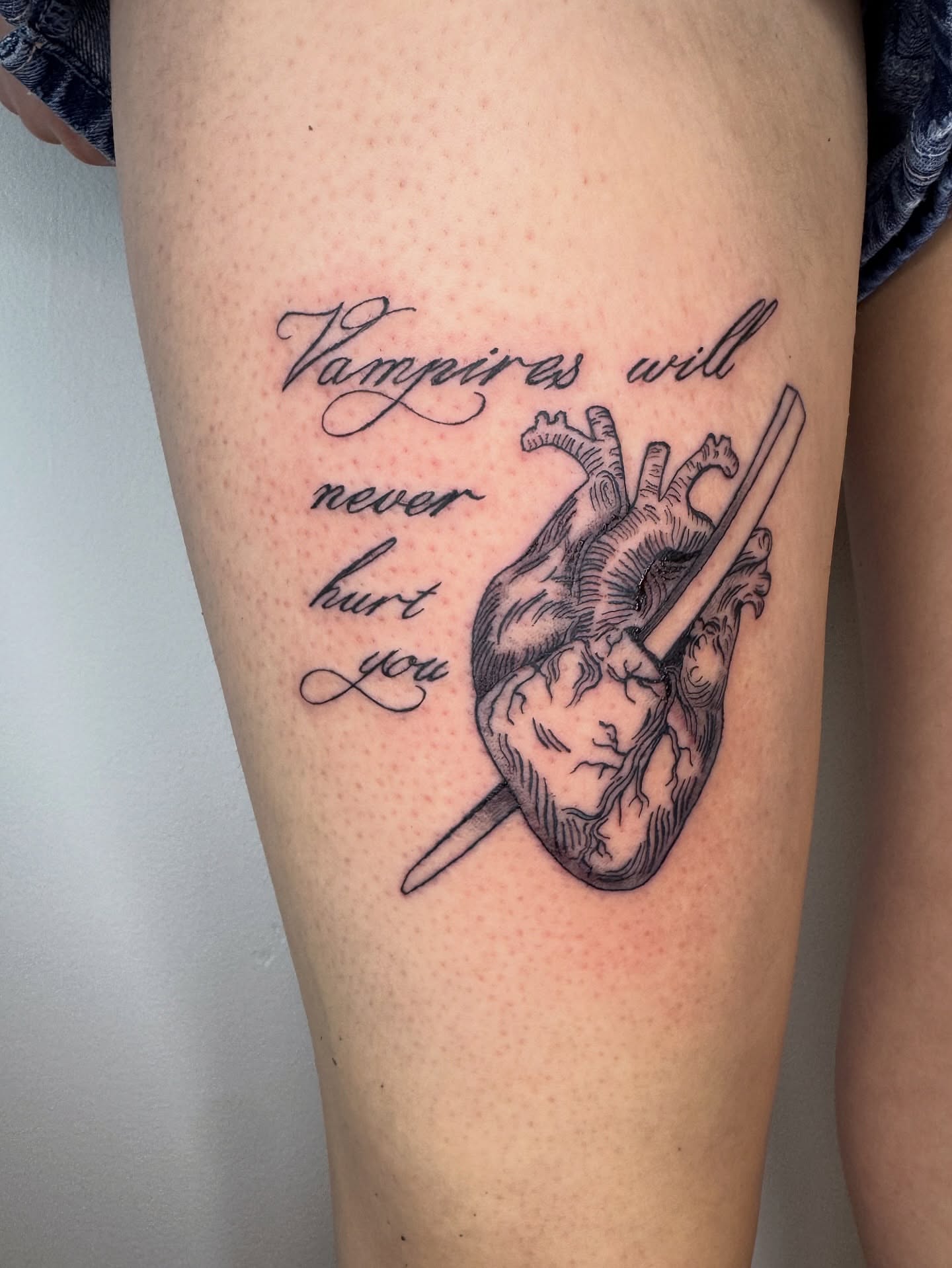 Heart with dagger realism tattoo on the thigh by dev