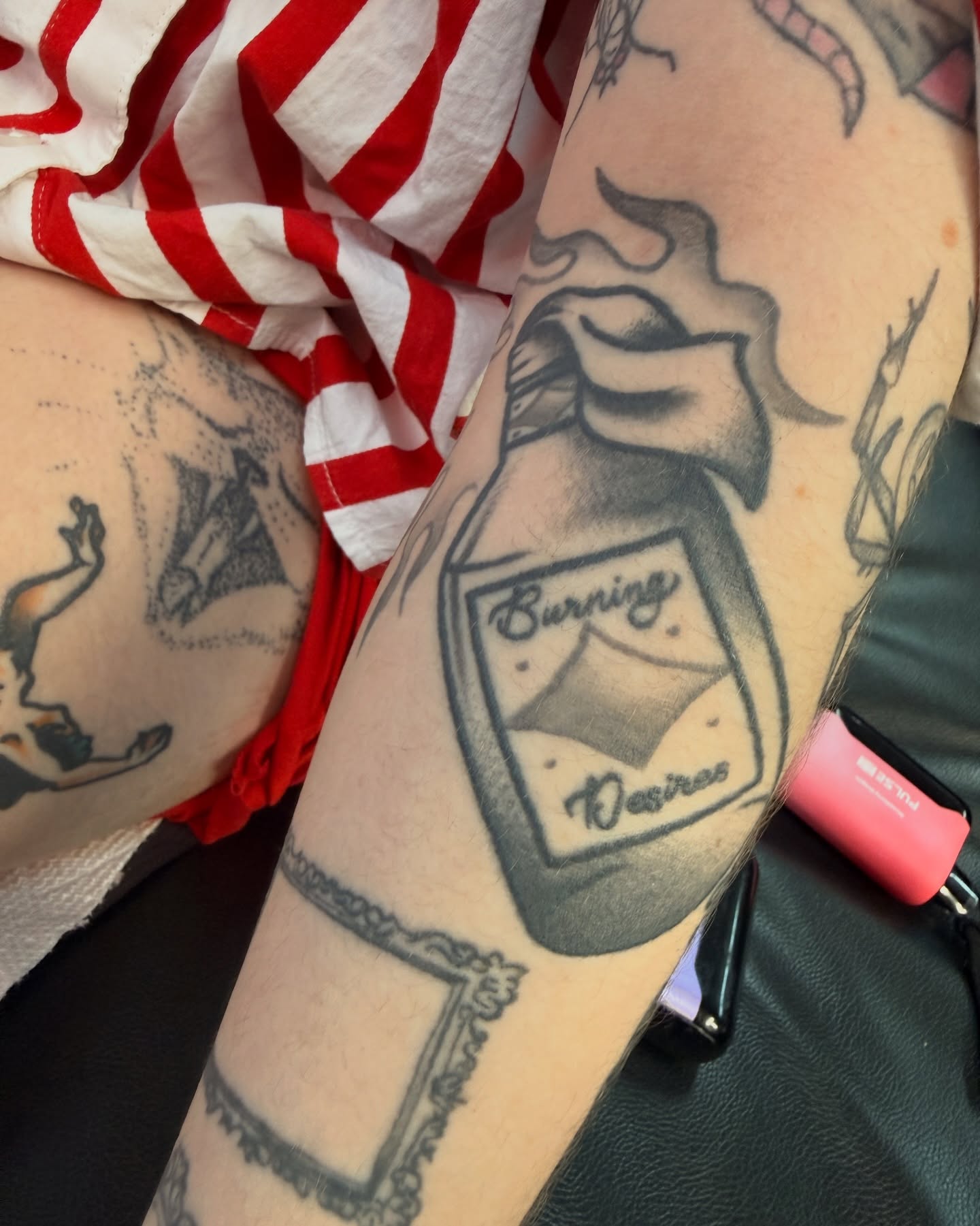 Burning desires black and grey tattoo on the forearm by Penny D Tattoos