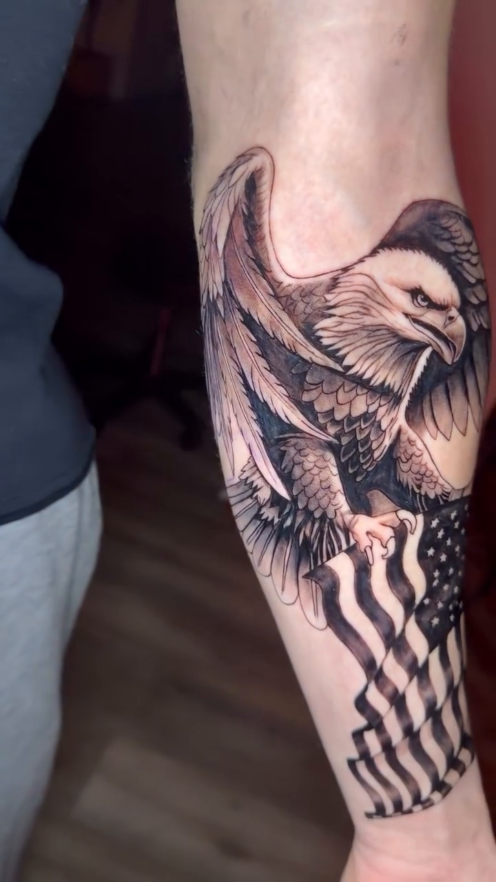 Eagle and American flag realism tattoo by Gage Cottrell