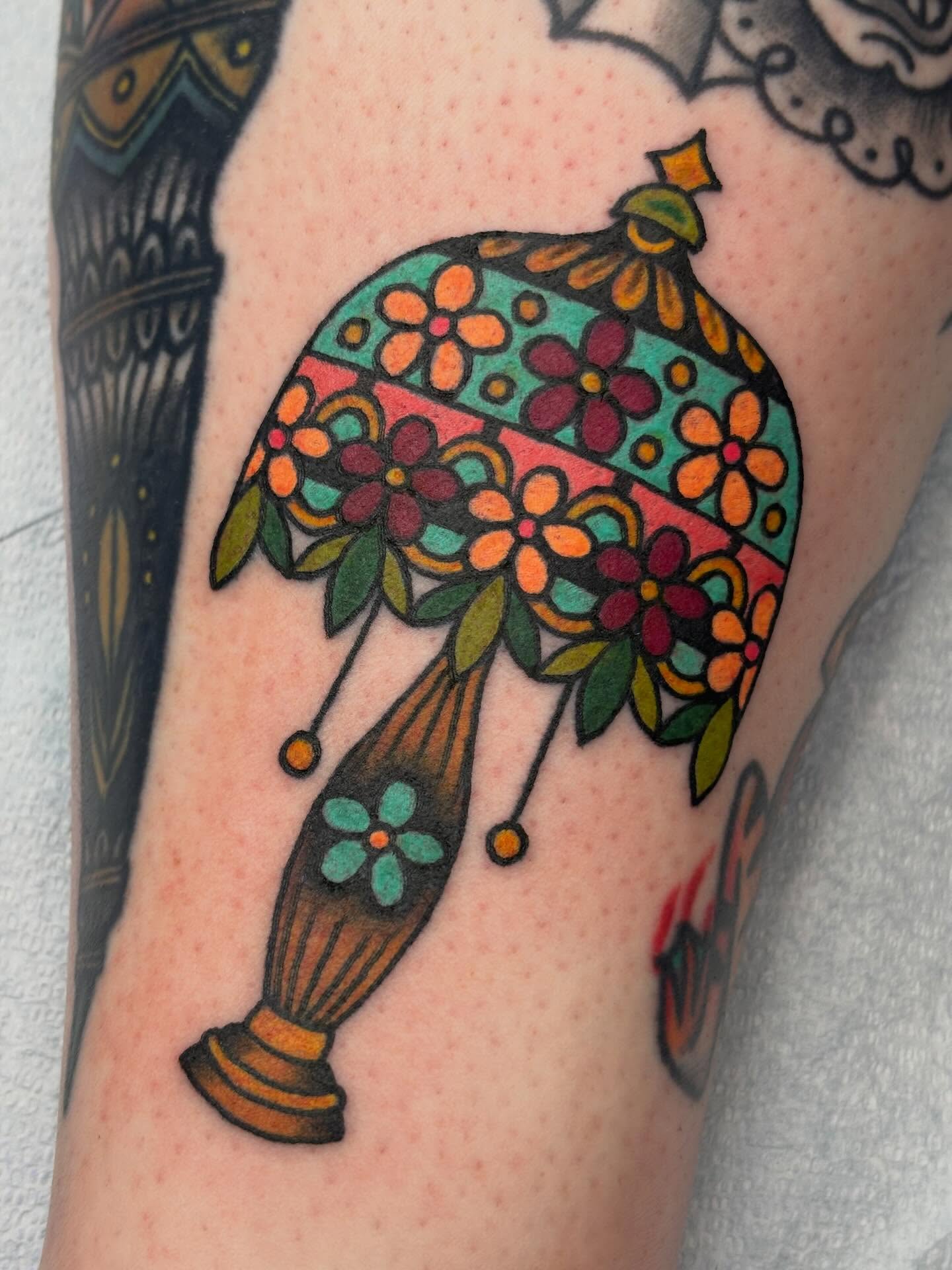 Vase with flowers American traditional tattoo on the forearm by Sydney Pflaumer