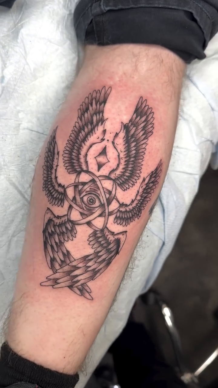 Winged eye with rose realism tattoo on the forearm by Michael Roehrich (MEECH!)