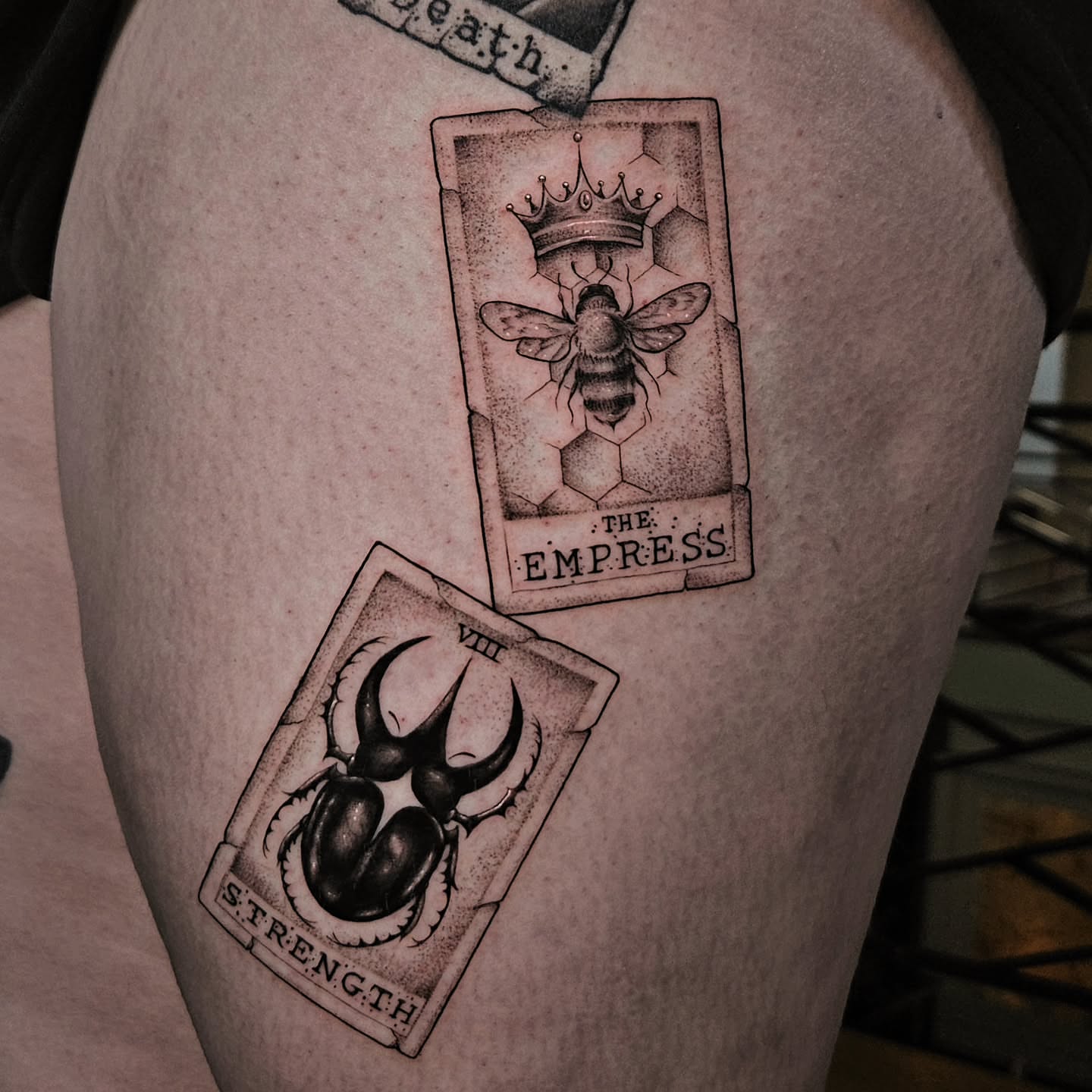 Tarot cards black and grey tattoo on the thigh by Courtlyn Bliss