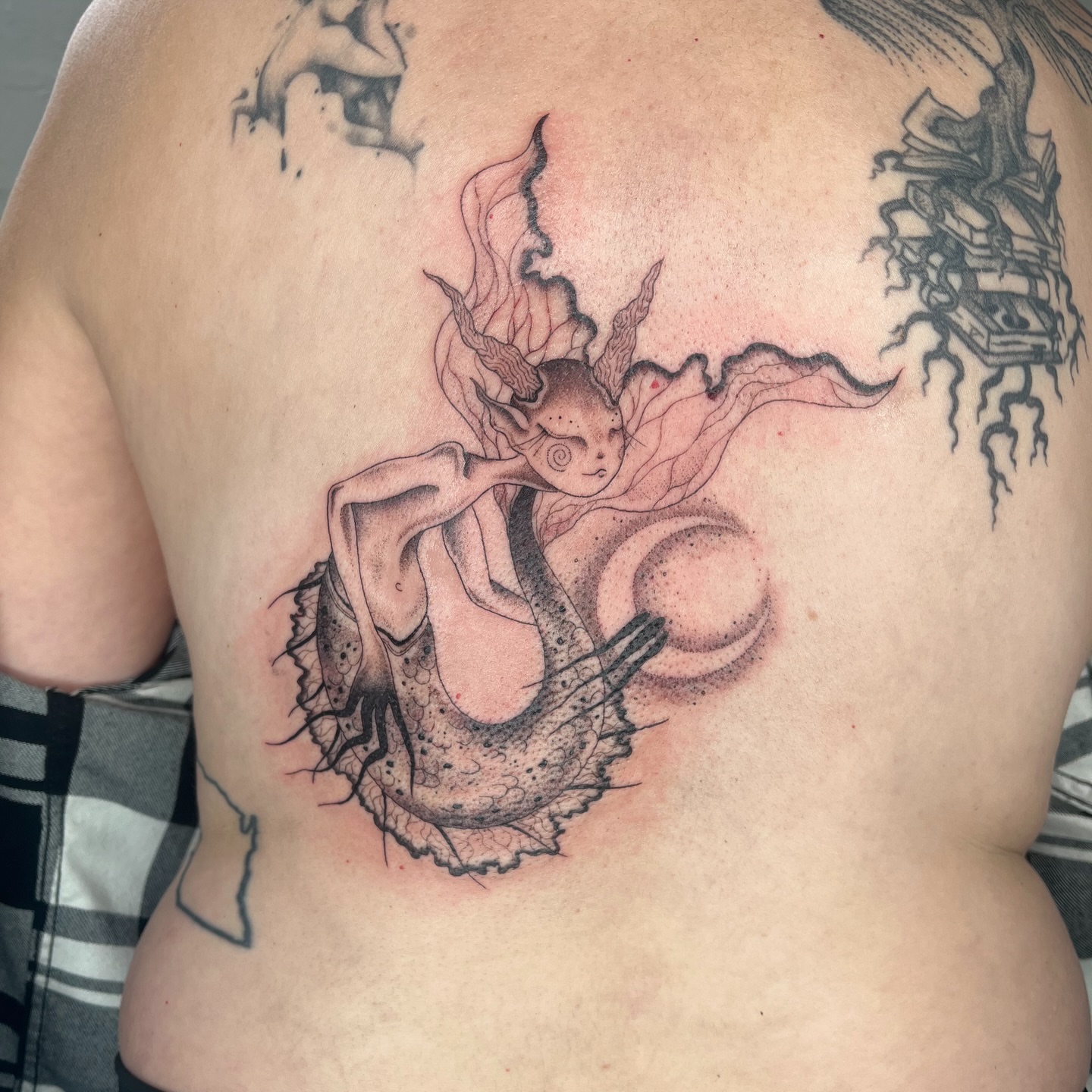 Mermaid dotwork tattoo on the chest by 𝔇𝔢𝔰𝔦