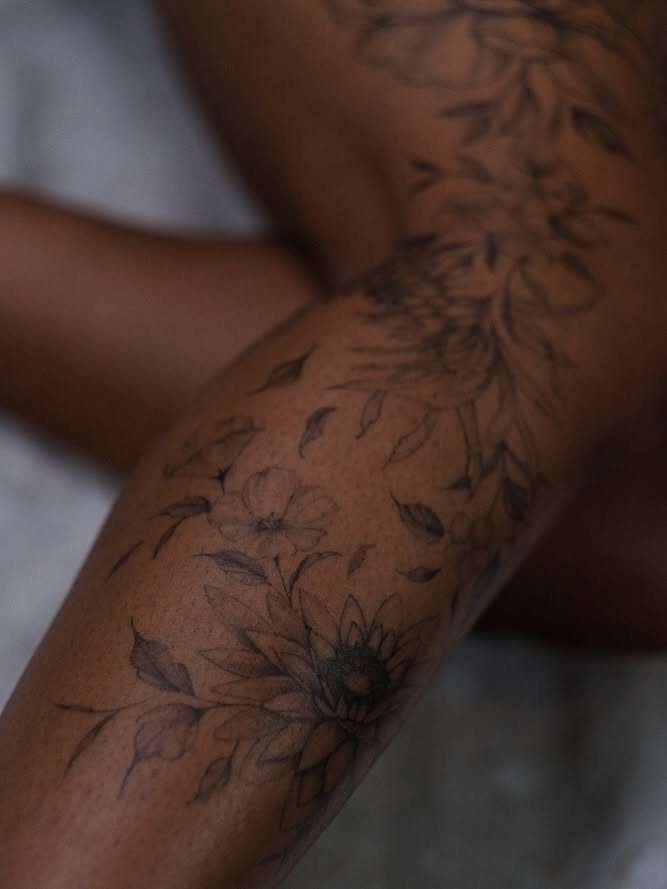 Floral design black and grey tattoo on the forearm by Temple Adorned Tattoo