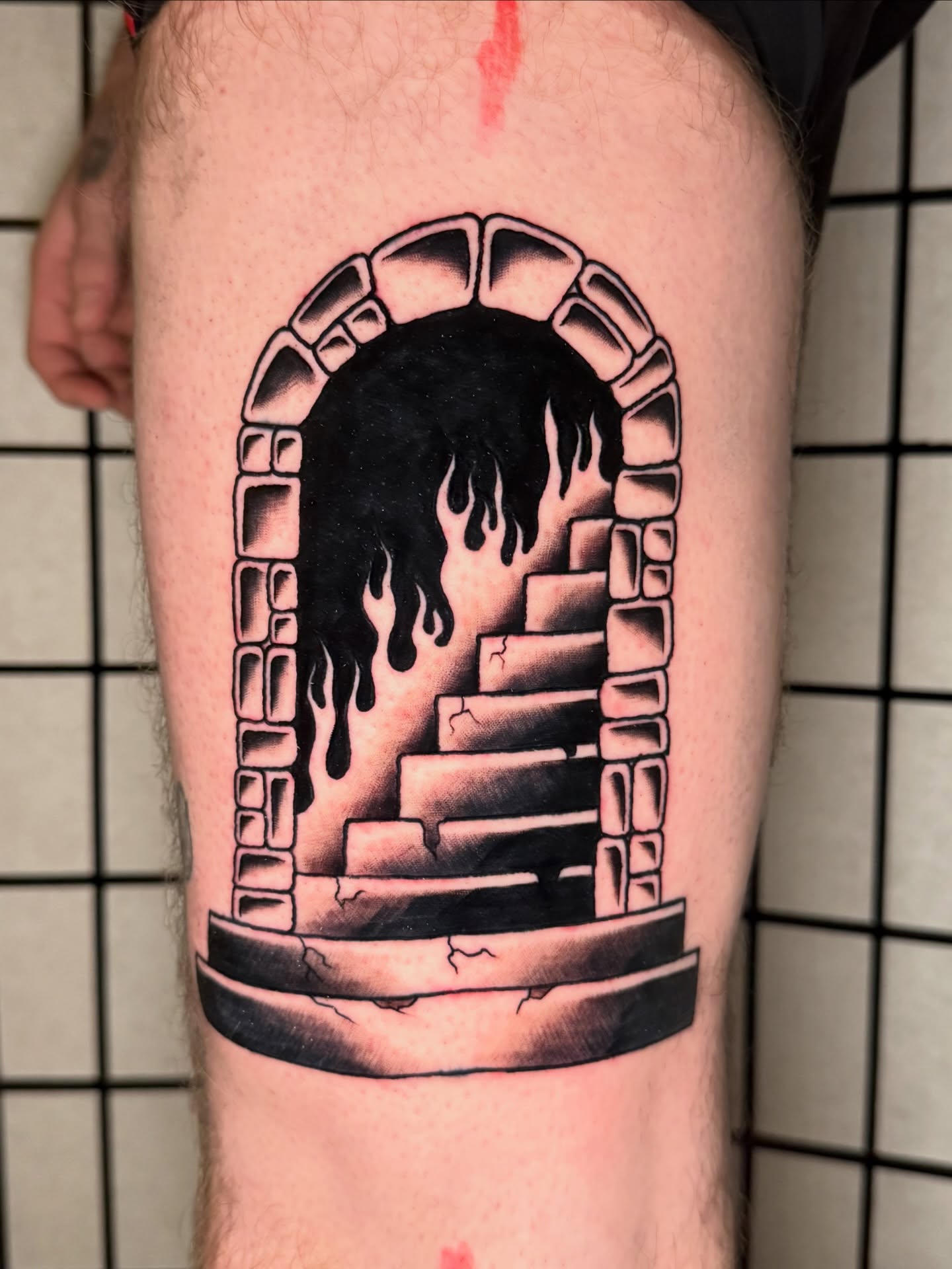 Staircase with dripping liquid dark realism tattoo on the thigh by Austin Poliszuk, Minneapolis, Minnesota