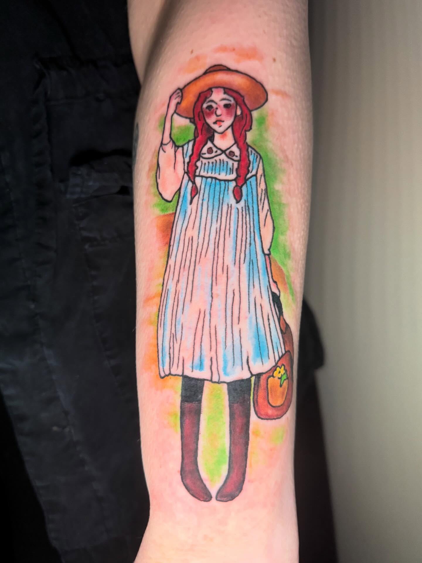 Girl with straw hat watercolor tattoo on the forearm by spikecitytattoo