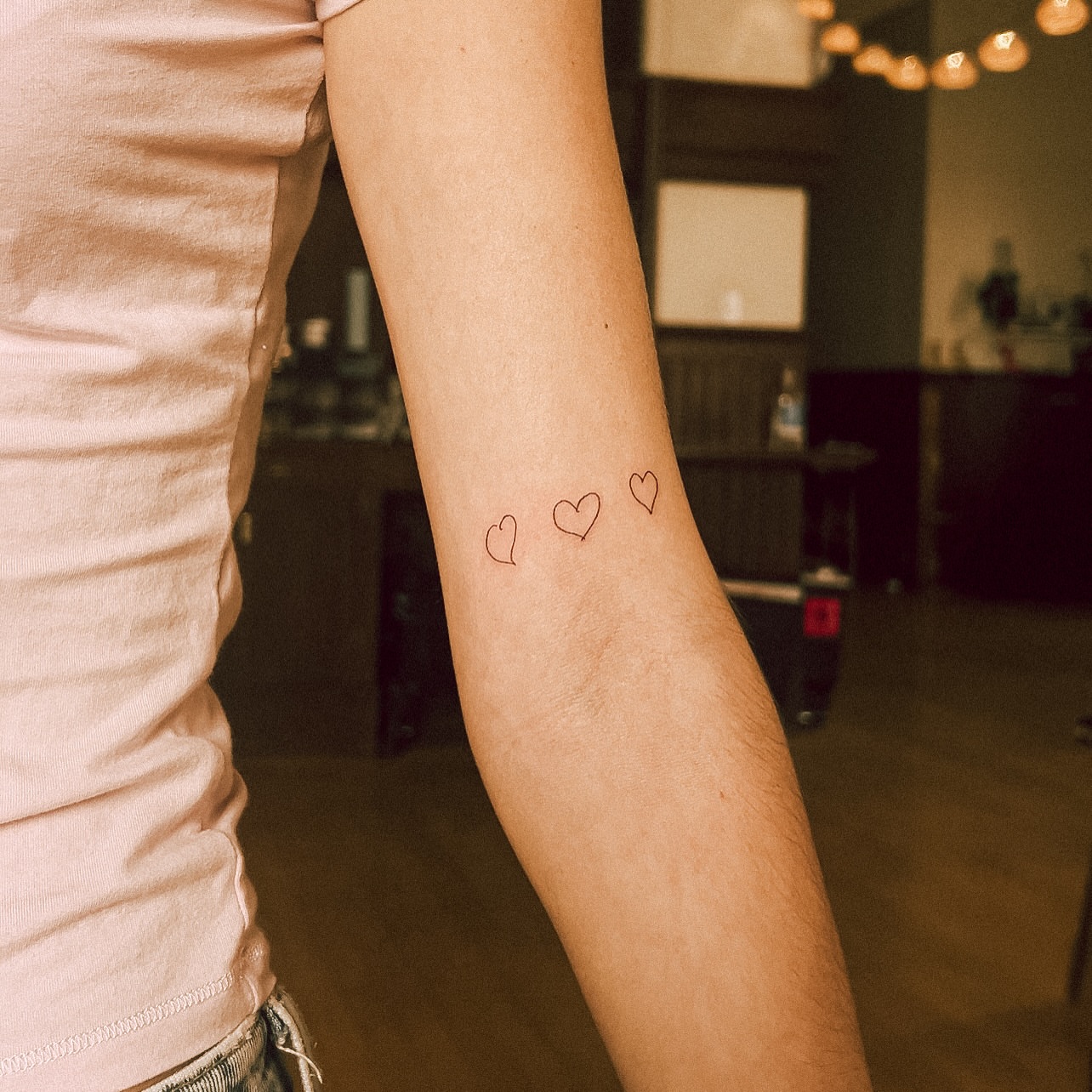 Three hearts fine line tattoo on the forearm by chloe ☼, Tacoma, Washington