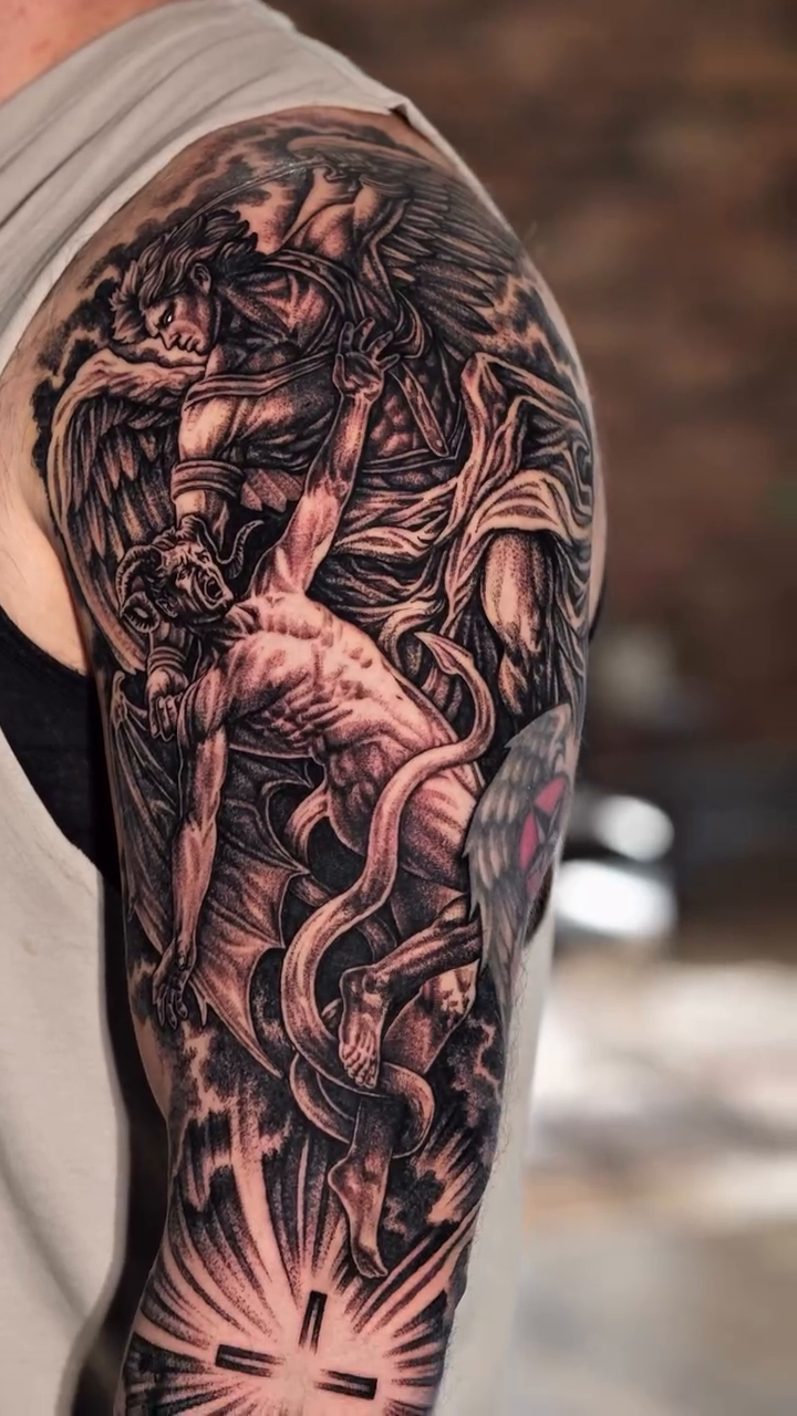 Angel and demon dark realism tattoo by Jack Alvarado.