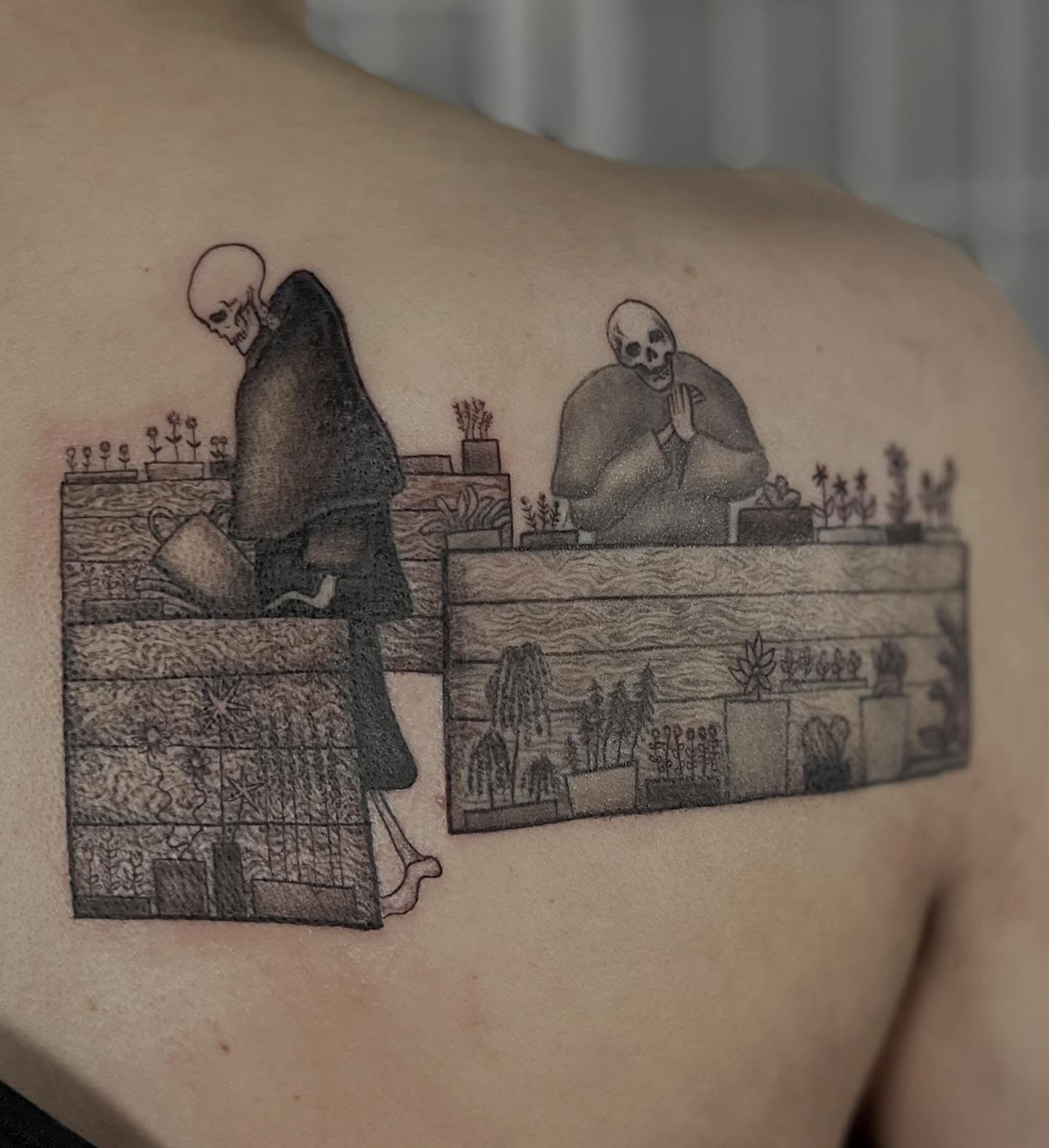 Skeletons at desk black and grey tattoo on the back by Tattoo Artist