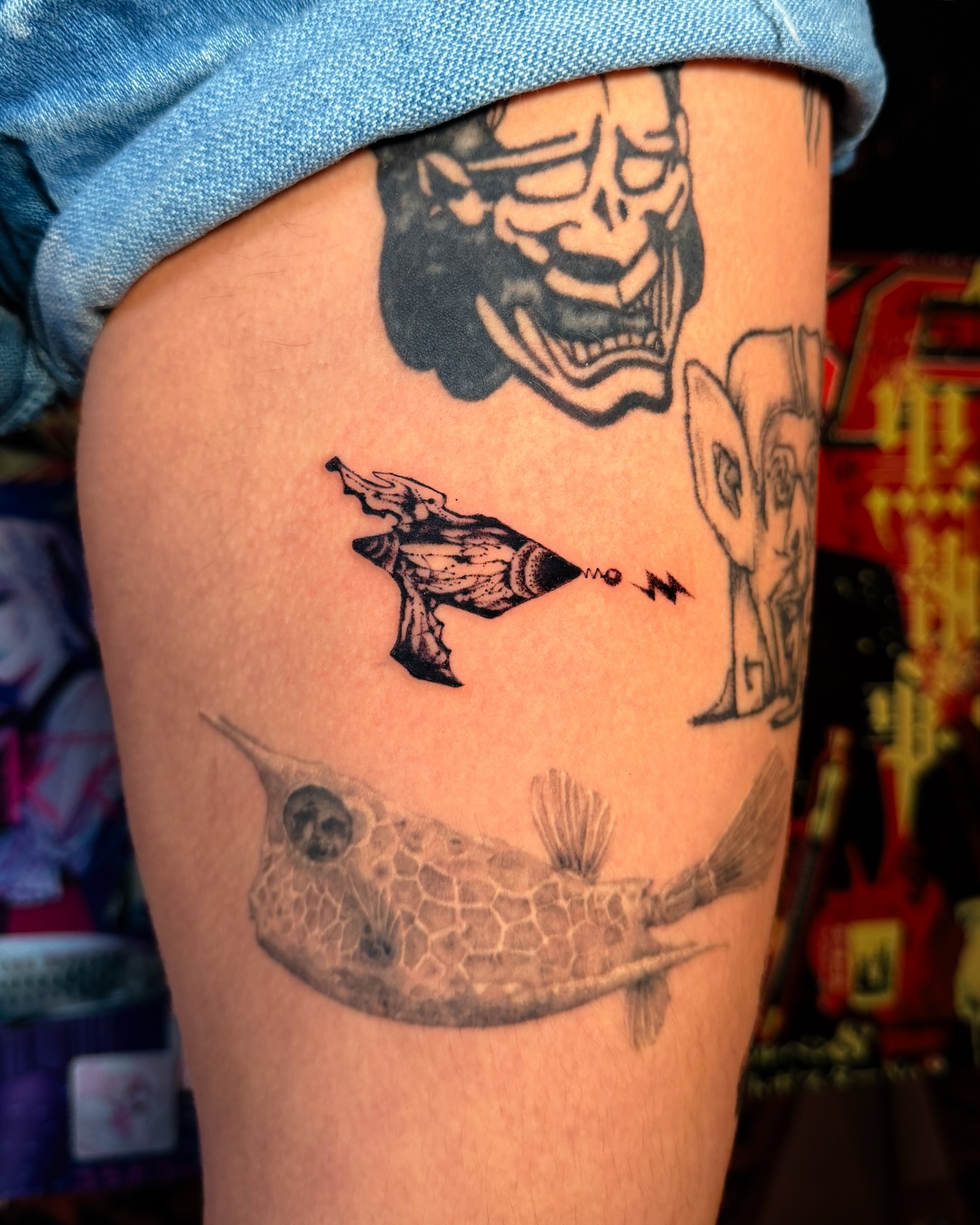 Swordfish and lightning bolt black and grey tattoo on the thigh by мια ѕυη