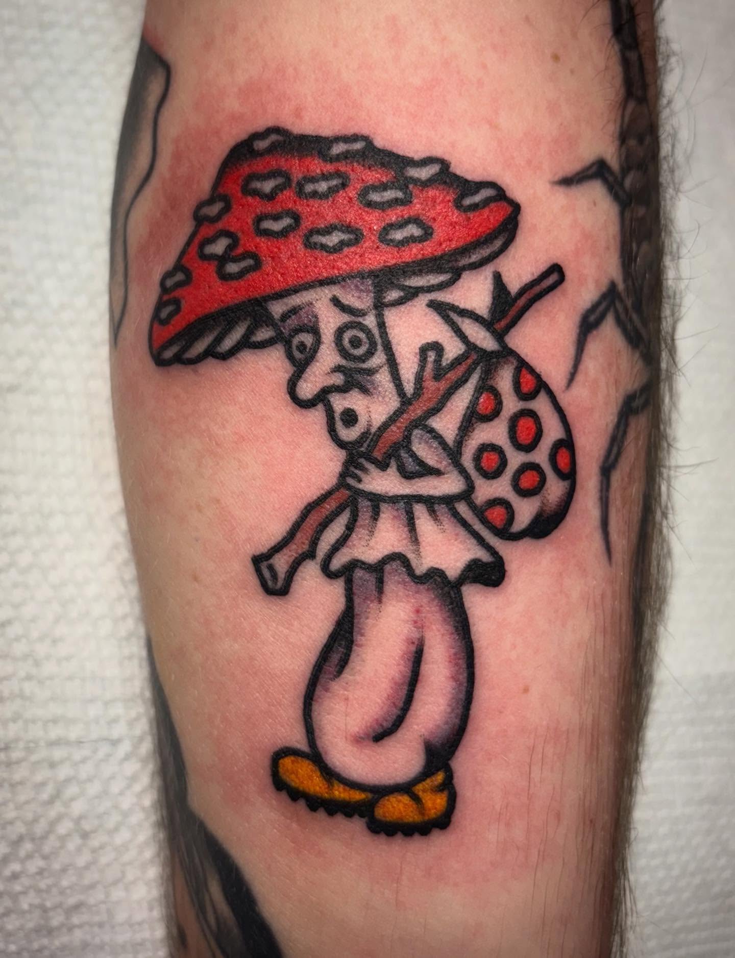 Mushroom character American traditional tattoo on the forearm by Danny DiBlasi, San Francisco, California