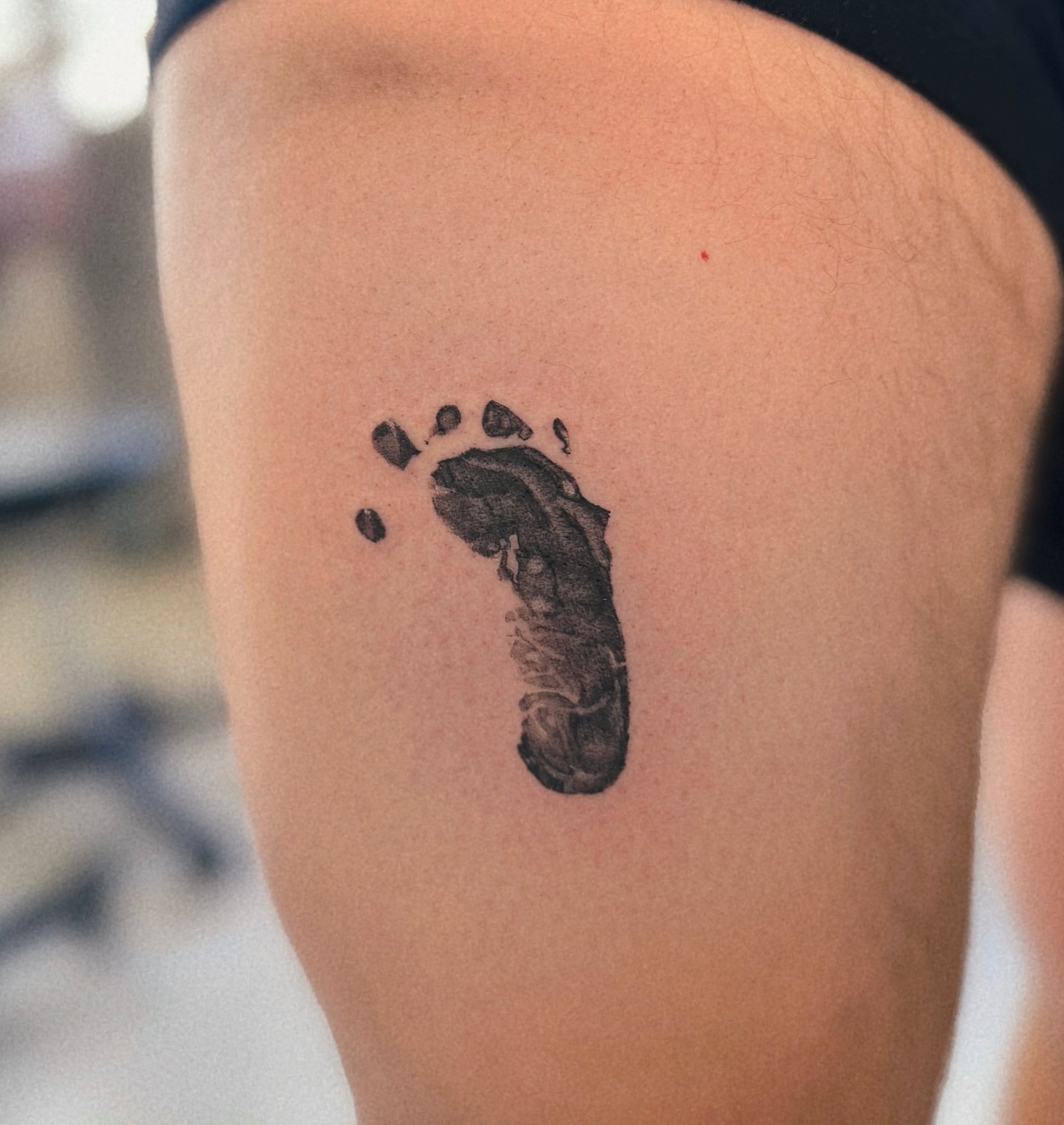 Footprint dotwork tattoo on the thigh by MJ