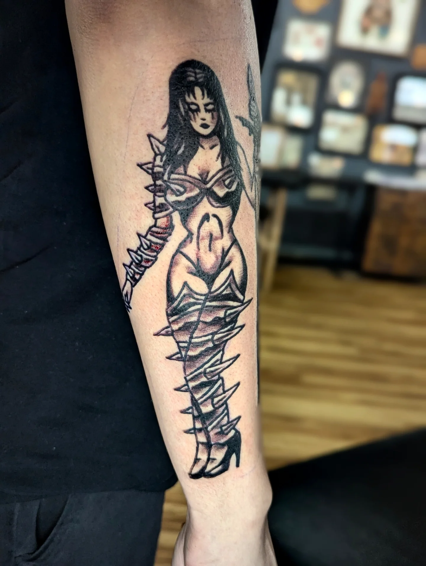 Woman with dagger realism tattoo on the forearm by Eric Ward