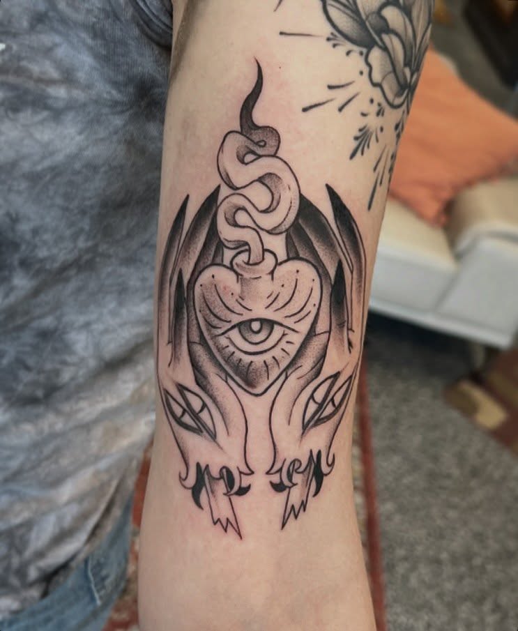 Heart with snake black and grey tattoo on the forearm by Callie πͺ