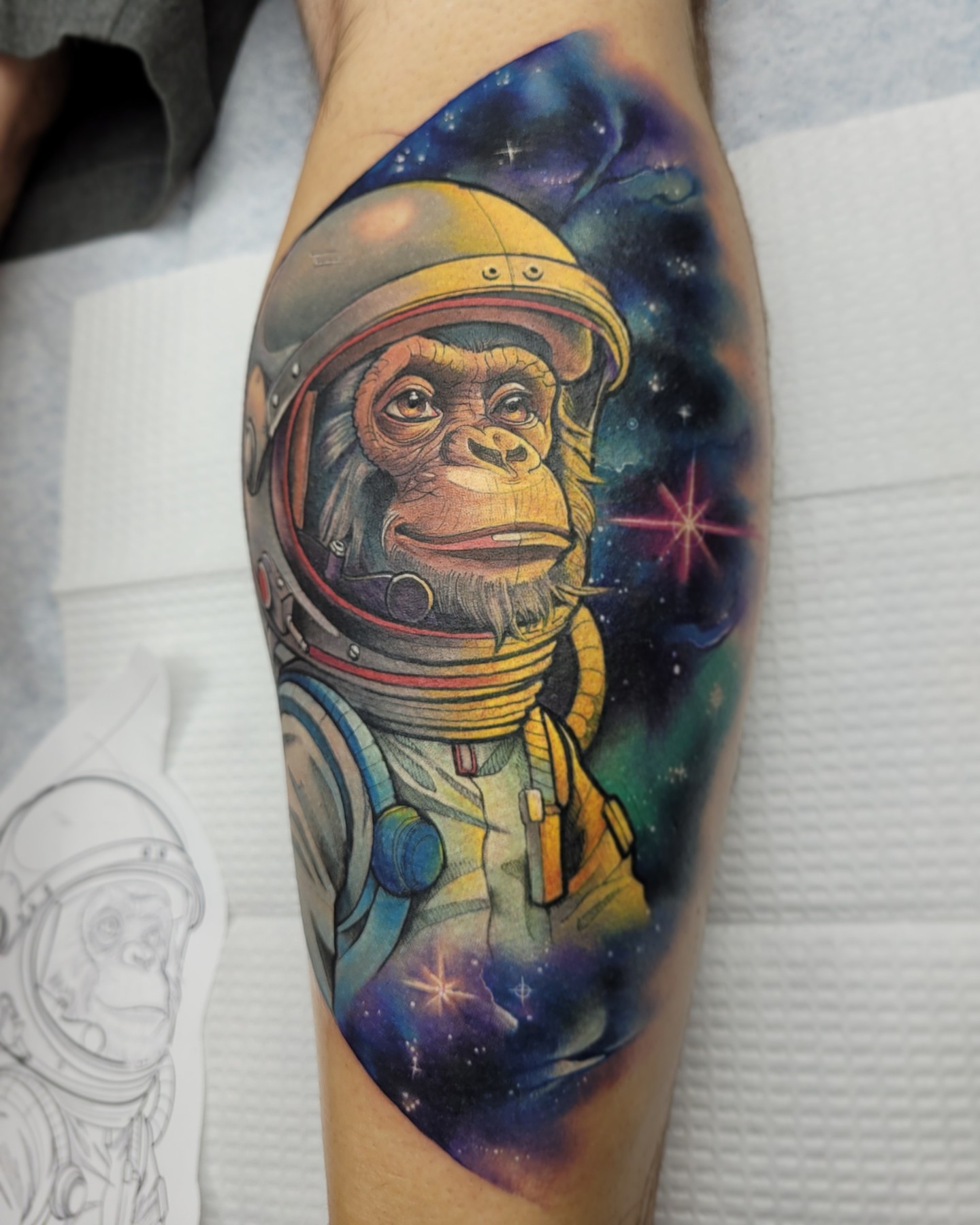 Astronaut monkey realism tattoo on the forearm by Jorell Elie