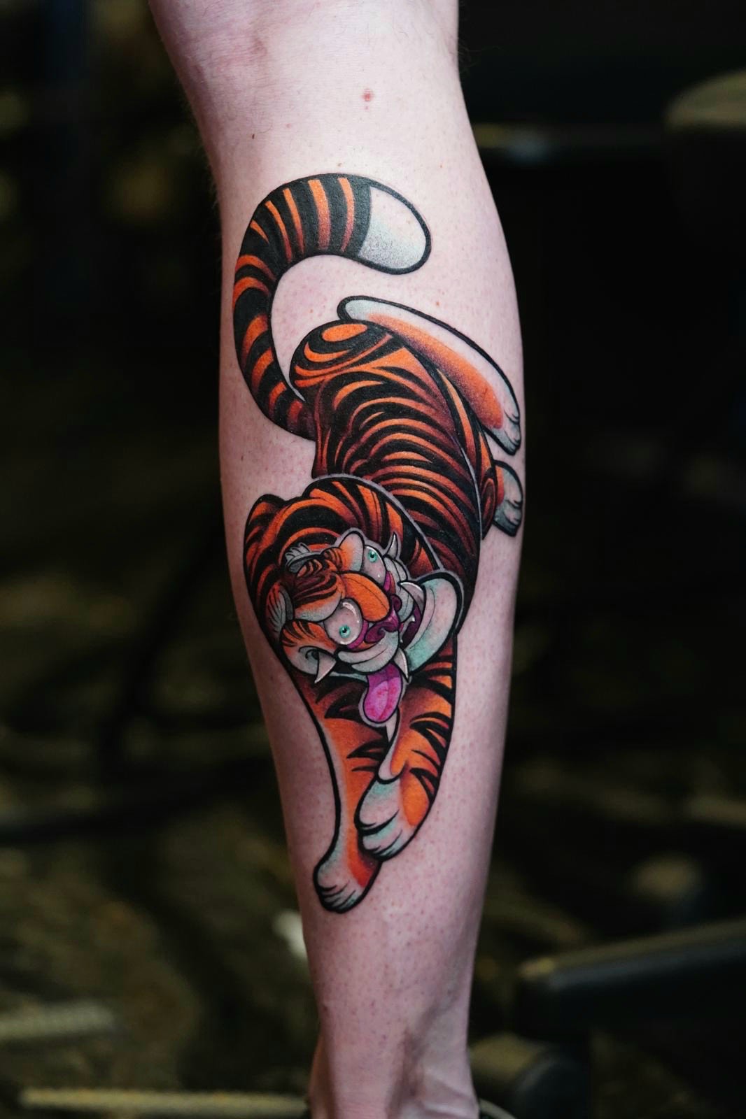 Tiger American traditional tattoo on the calf by Jorell Elie