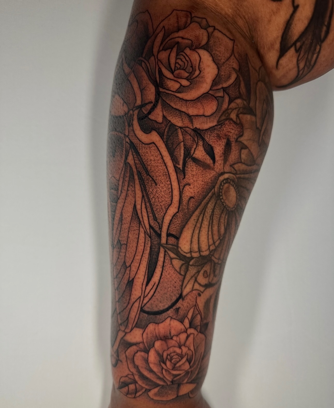 Roses and butterfly realism tattoo on the forearm by zoe mars