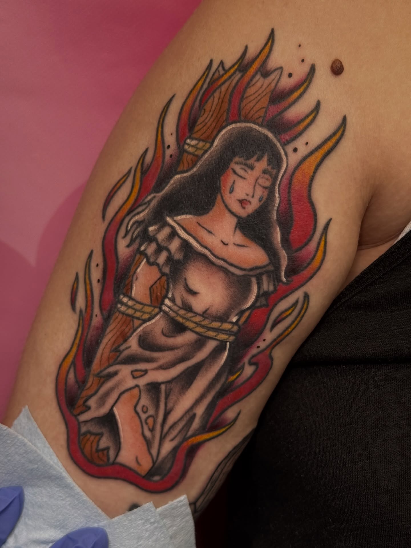 Flaming woman American traditional tattoo on the upper arm by Chelsea Graham, Seattle, Washington