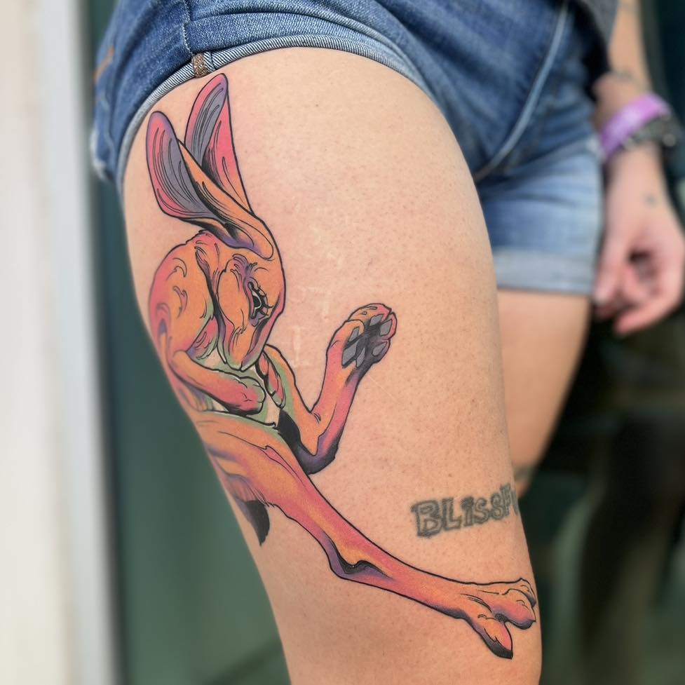 Rabbit realism tattoo on the thigh by Haylie Adele Strong