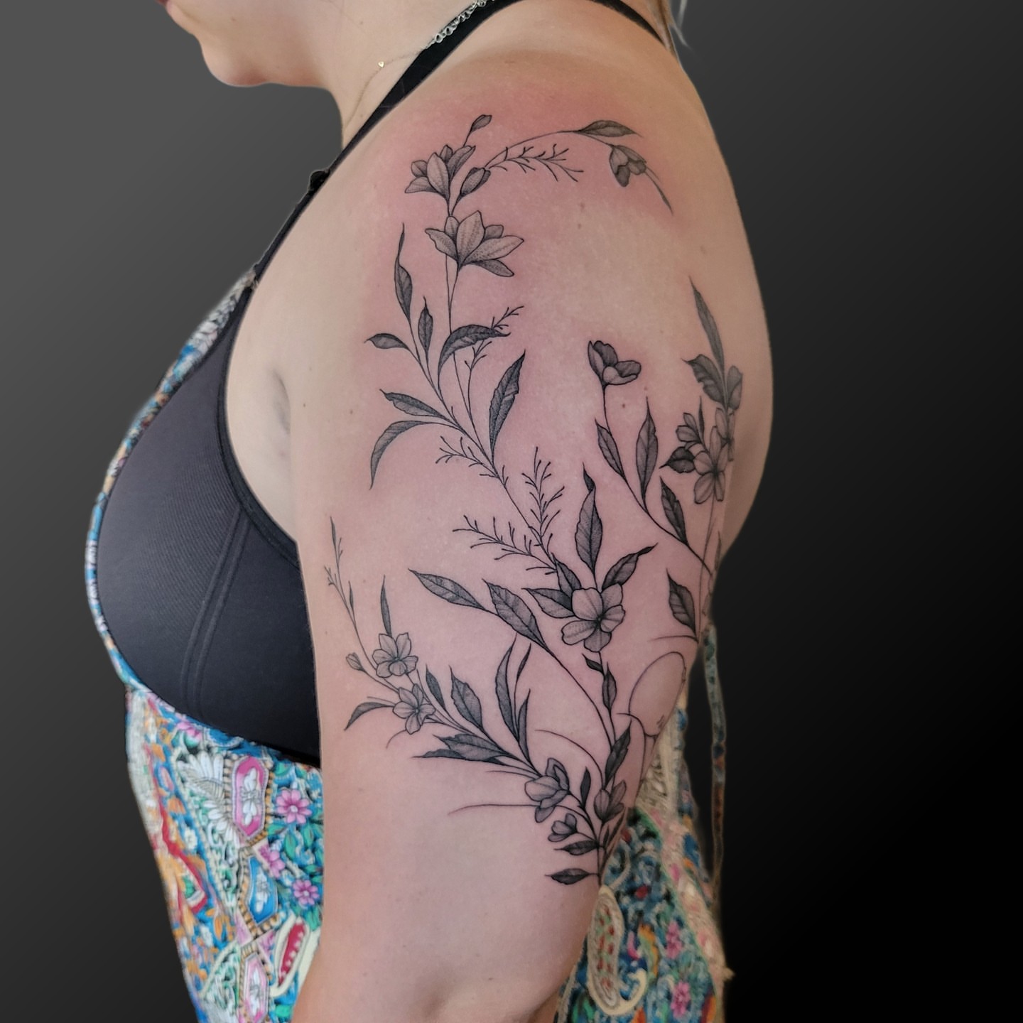 Floral vine black and grey tattoo on the shoulder by Arick Reese