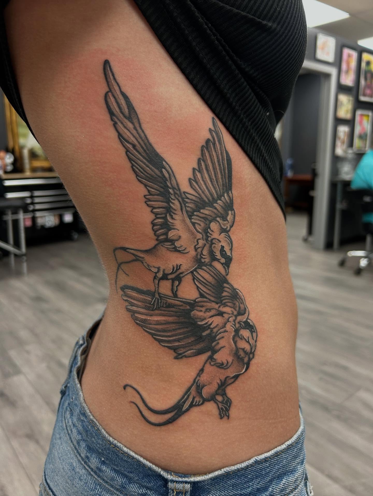Phoenix black and grey tattoo on the thigh by Livy baby
