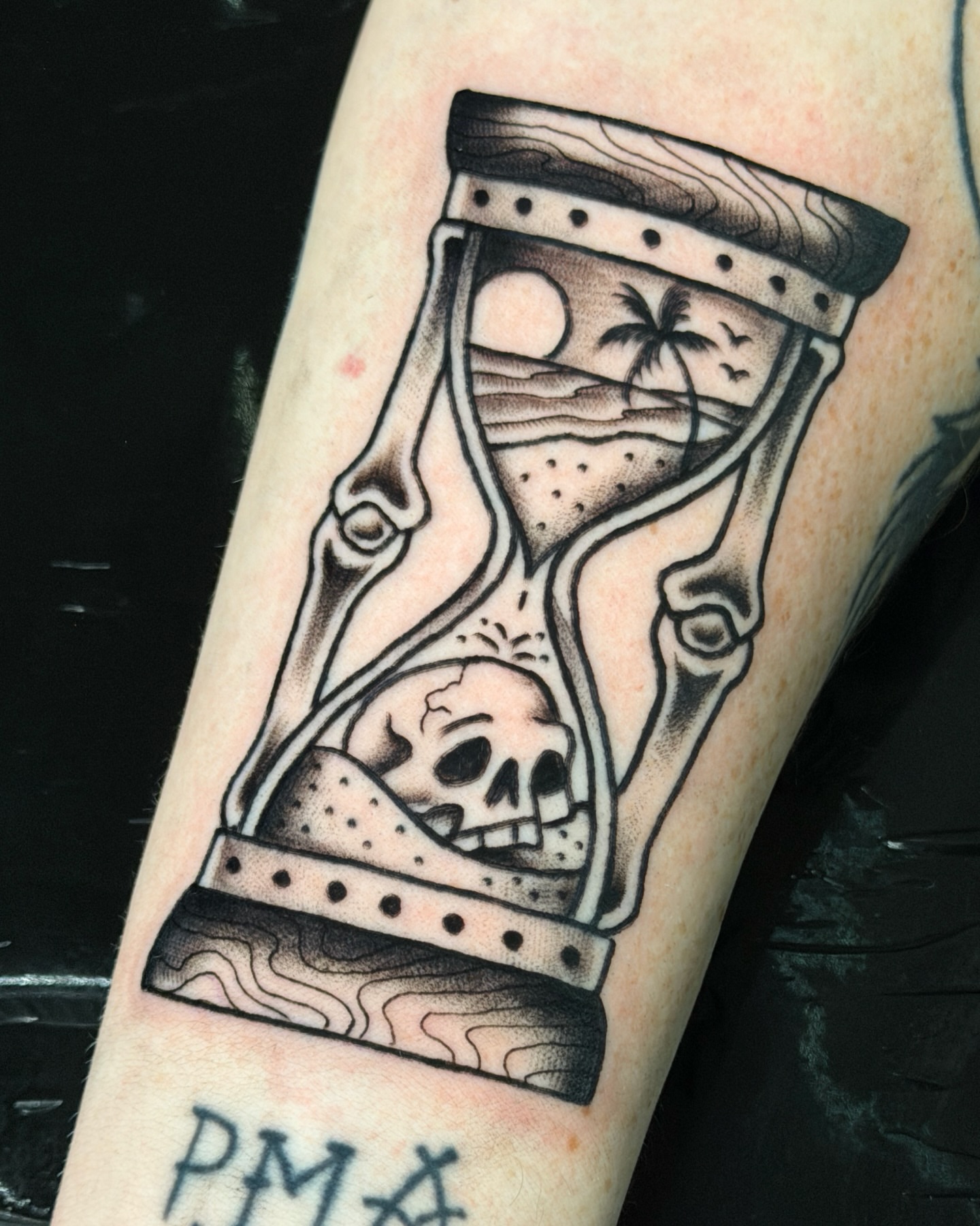 Hourglass with skull American traditional tattoo on the forearm by R e N O T