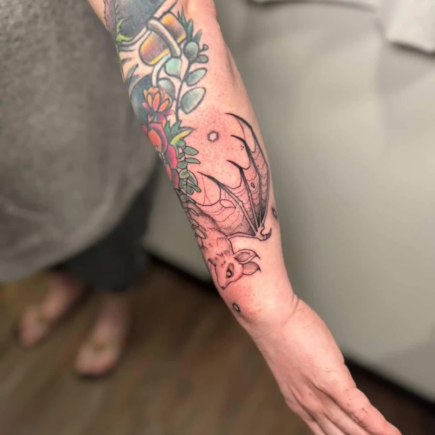 Elephant and flowers American traditional tattoo on the forearm by Tatum